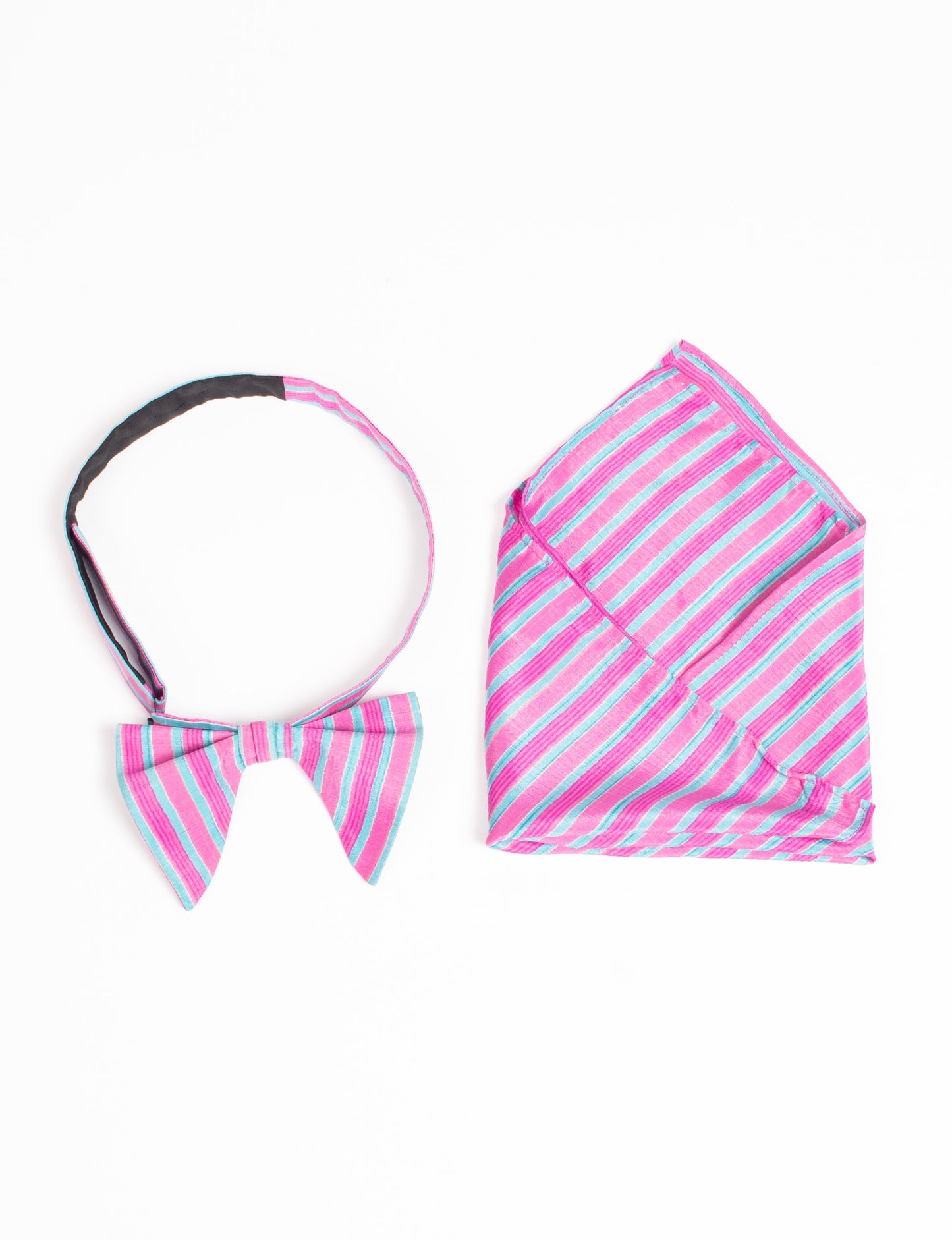 Dapper BOW TIE & POCKET SQUARE SET, ethically handcrafted with lively prints and eye-catching colors. Made by Mumbai-based craftswomen, this ensemble adds excitement to classic formal-wear. Sustainable fashion supporting fair trade, slow fashion, and empowering women artisans. A powerful story of transformation.