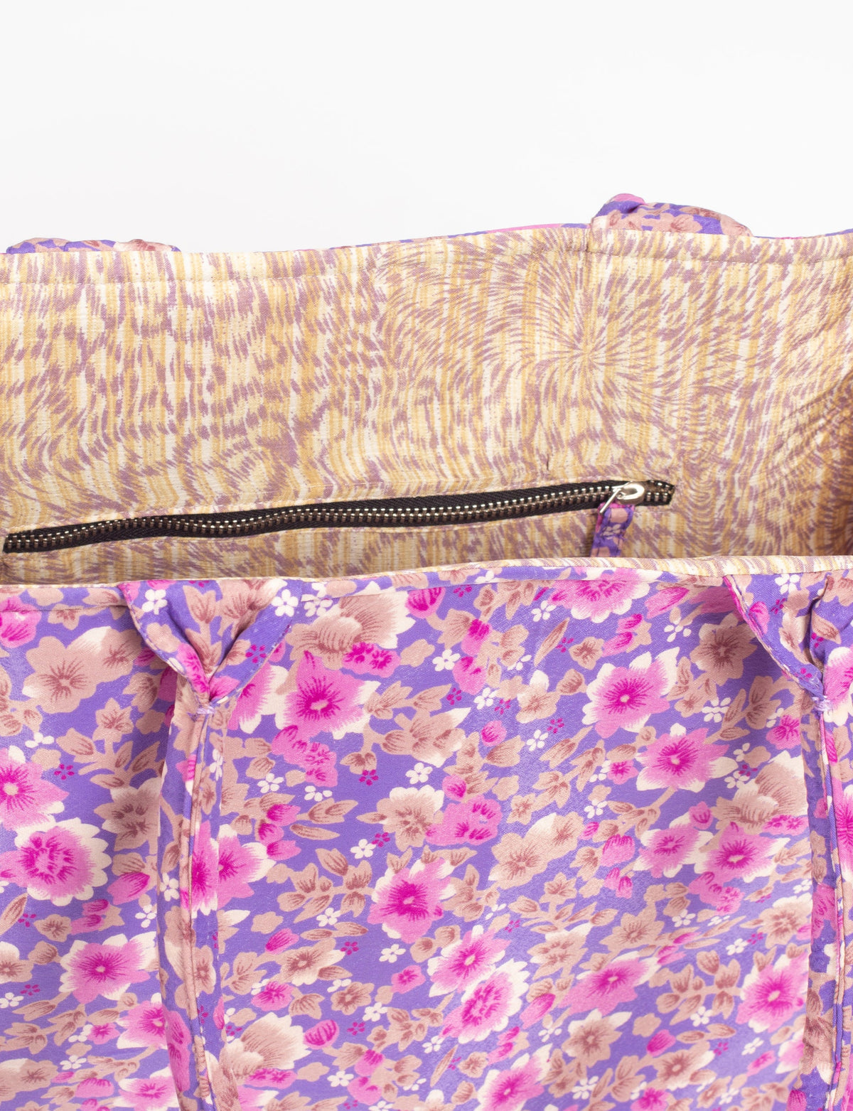 Purple floral fabric work tote bag interior with beige and purple patterned lining and black zipper pocket