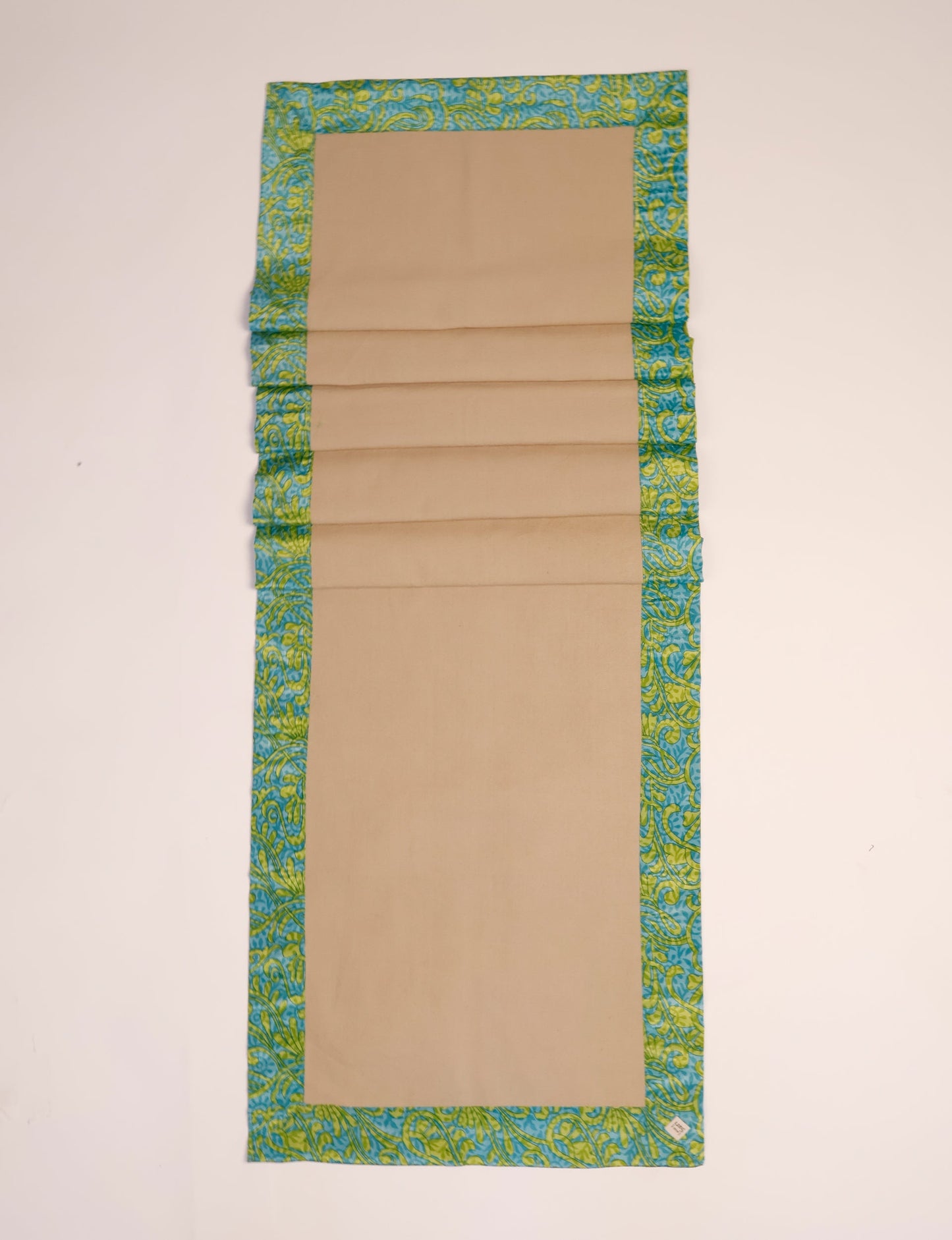 Crafted with care, our 160x40 cm reversible table runner is a blend of 100% cotton canvas and upcycled sari fabric. Ethical, green, and designed for sustainability, this piece adds a unique touch to your dining setup, sparking conversations about eco-friendly living.