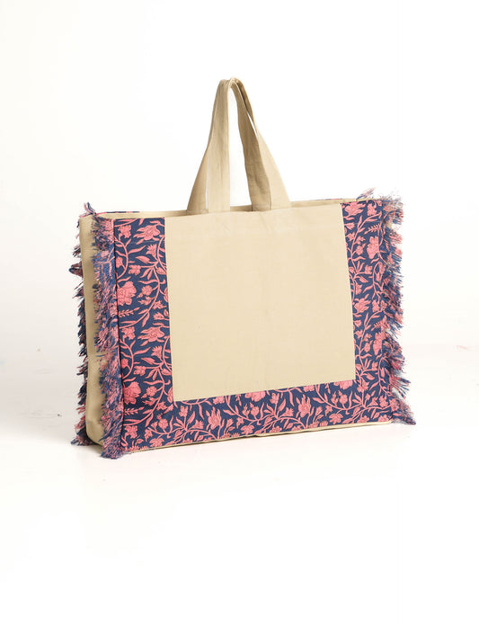 Lighten your eco-load with our FRINGE CARRY-ALL BAG. Soft canvas with a patchwork design, inside lining made of vibrant sari fabric, and beautifully soft sari-fringed edging. Crafted with 100% cotton canvas for a sustainable and stylish carry-all.