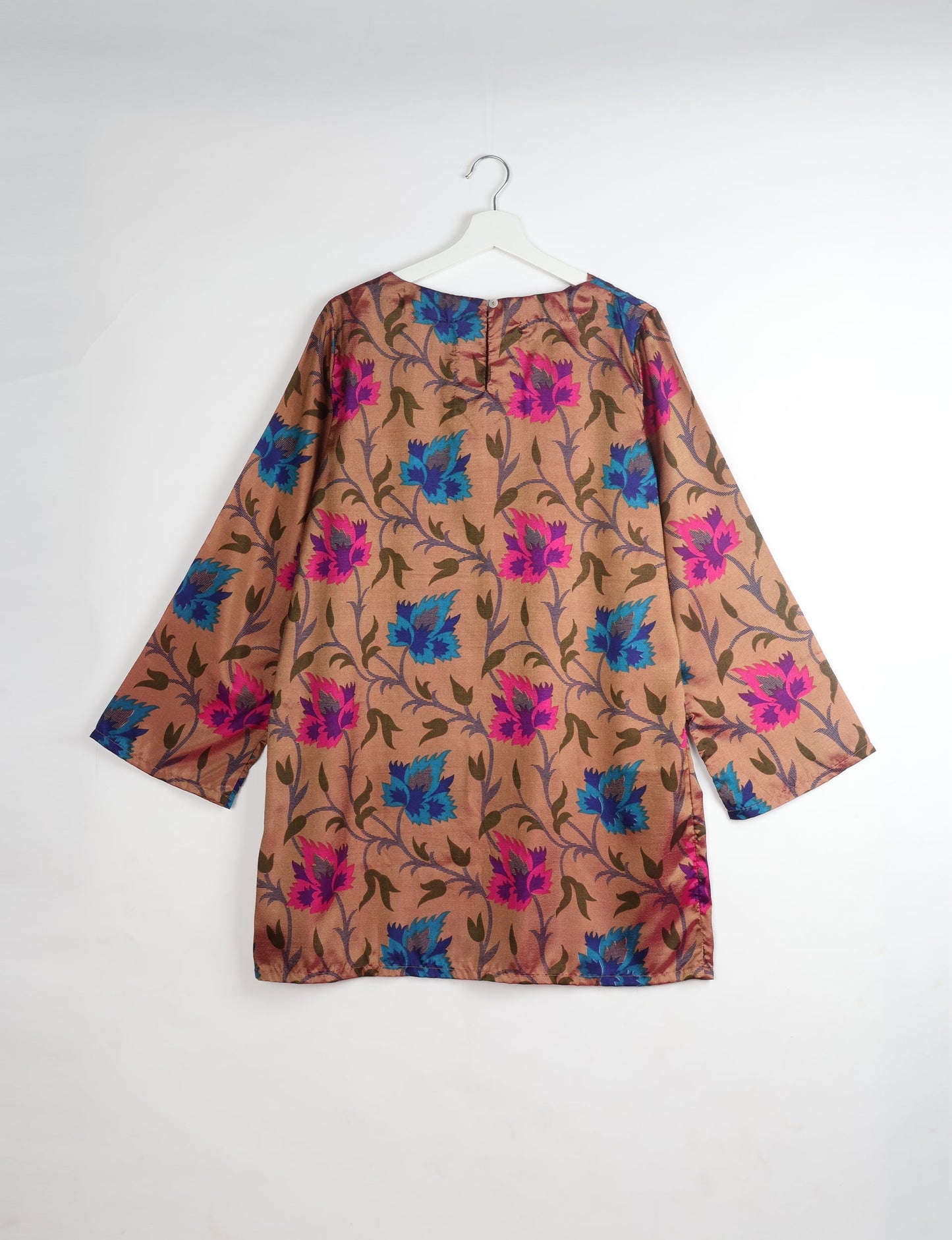 Chic and conscious, our A-line mini swing dress is a must-have in sustainable fashion. Adorned with flared sleeves, a keyhole back opening, and a mother of pearl button with twill tape loop. This zero waste, upcycled garment reflects the essence of eco-friendly and ethical clothing.