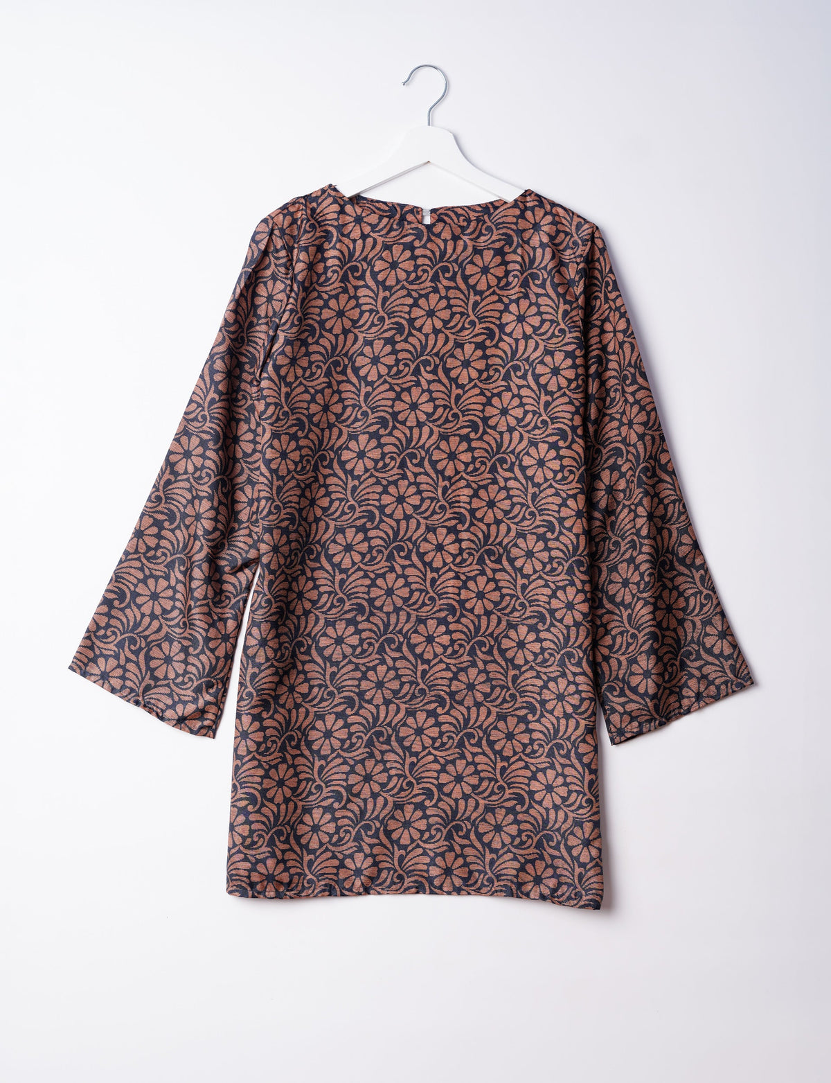 Chic and conscious, our A-line mini swing dress is a must-have in sustainable fashion. Adorned with flared sleeves, a keyhole back opening, and a mother of pearl button with twill tape loop. This zero waste, upcycled garment reflects the essence of eco-friendly and ethical clothing.