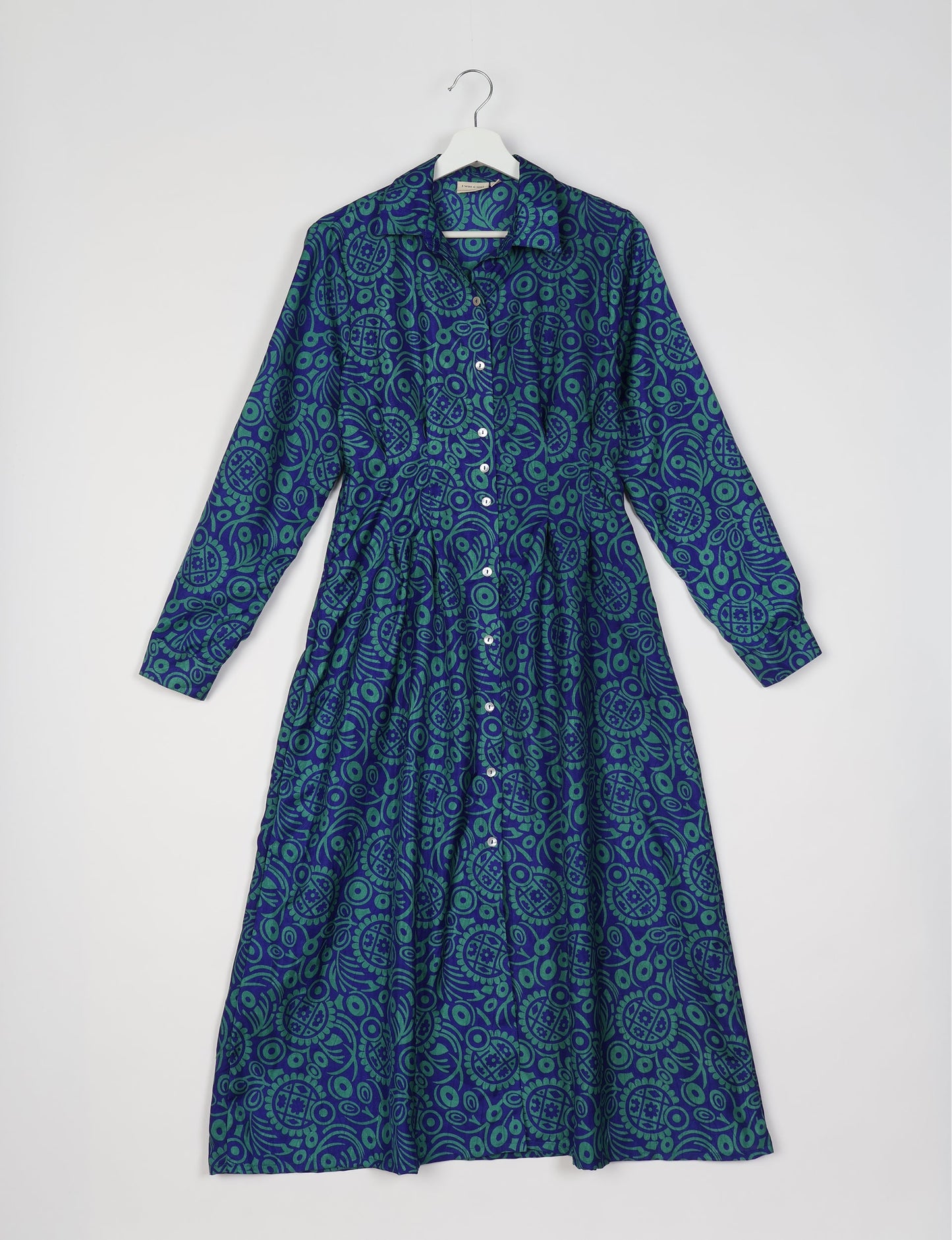 Midi shirt dress with cinched waist, crafted from recycled fabric. A sustainable women's clothing piece representing ethical fashion, eco-friendly products, and upcycled women's clothing.