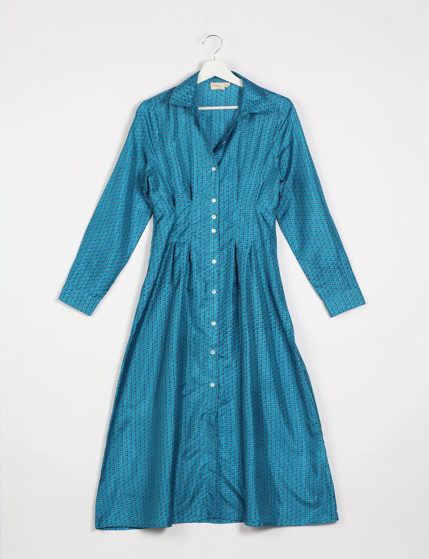 Midi shirt dress with cinched waist, crafted from recycled fabric. A sustainable women's clothing piece representing ethical fashion, eco-friendly products, and upcycled women's clothing.