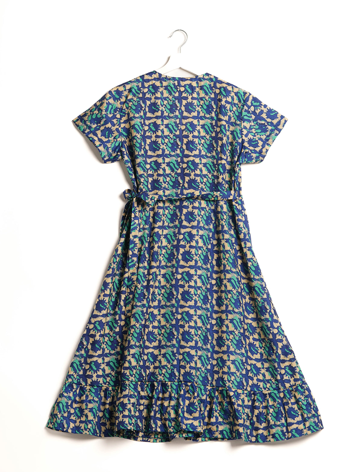 Embrace timeless elegance with our MIDI WRAP DRESS – a midi-length beauty featuring a v-neck, flattery from all angles, and a charming sari belt. Crafted from sustainable materials, this dress embodies ethical clothing and green fashion. Sophisticated with a frill tier at the hem and short cap sleeves, this dress is perfect for any occasion. Tie up the beautifully crafted sari belt on the side for a versatile, stylish, and eco-friendly look.