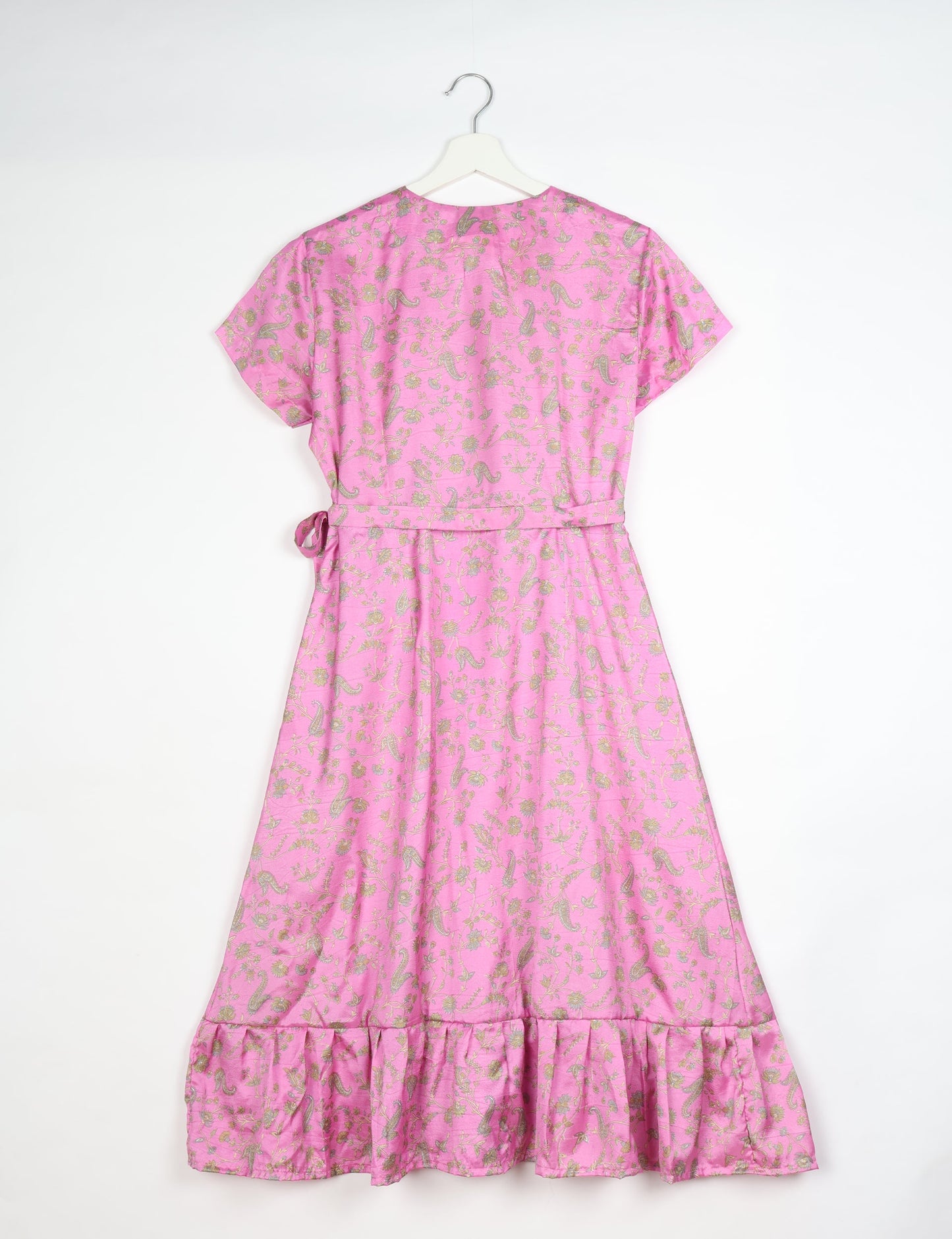 Embrace timeless elegance with our MIDI WRAP DRESS – a midi-length beauty featuring a v-neck, flattery from all angles, and a charming sari belt. Crafted from sustainable materials, this dress embodies ethical clothing and green fashion. Sophisticated with a frill tier at the hem and short cap sleeves, this dress is perfect for any occasion. Tie up the beautifully crafted sari belt on the side for a versatile, stylish, and eco-friendly look.