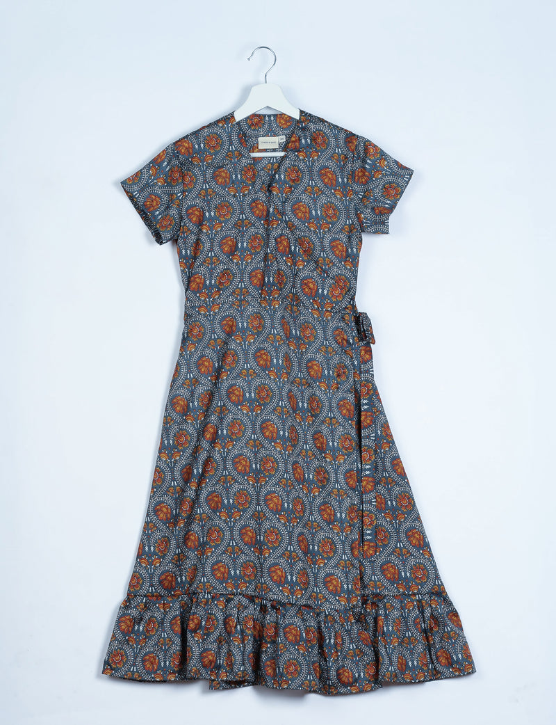 Grey wrap dress with orange floral tropical print, short sleeves, ruffle hem, and side tie belt, shown flat on hanger