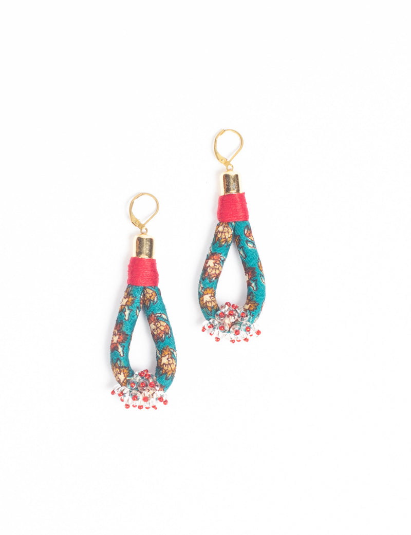 Floral patterned fabric drop earrings with red thread wrap, gold-tone hooks, and clear and red bead clusters at the bottom