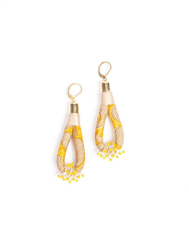 Yellow and beige fabric loop drop earrings with gold-tone hooks and small yellow and clear bead clusters at the bottom