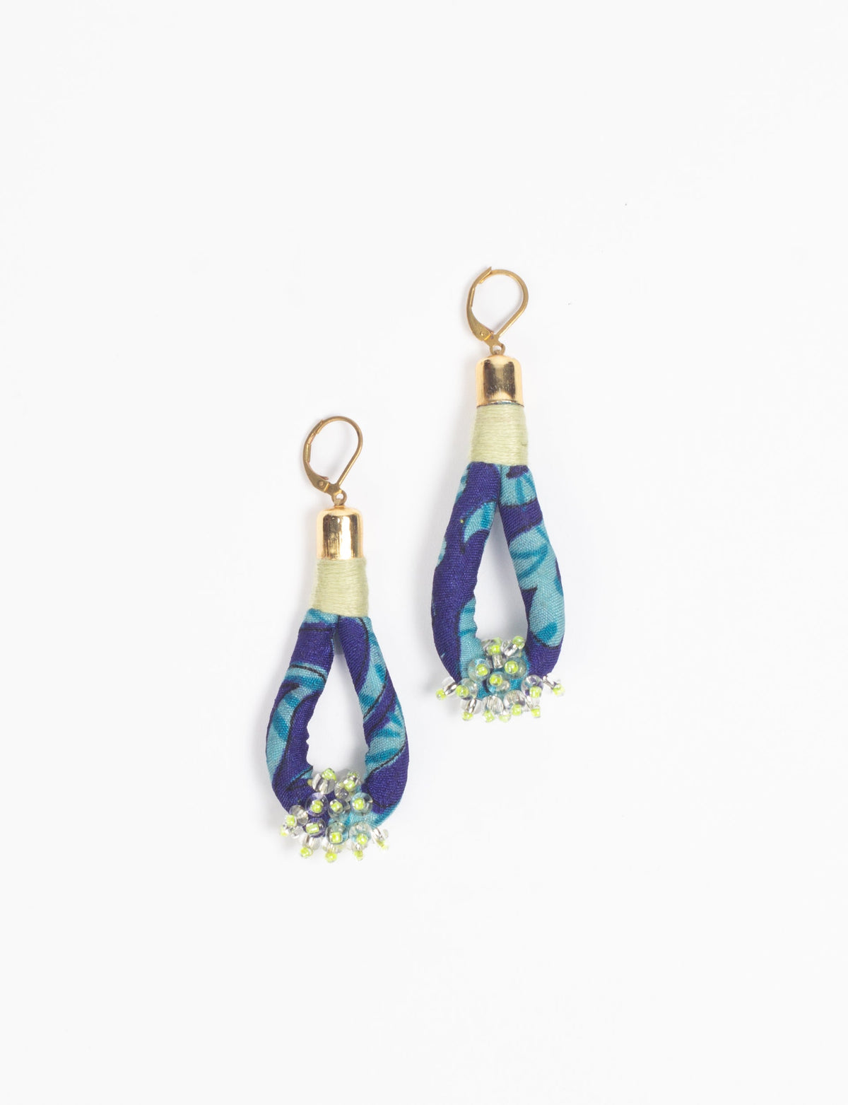 Blue fabric loop drop earrings with gold-tone tops and small green and clear bead clusters at the bottom