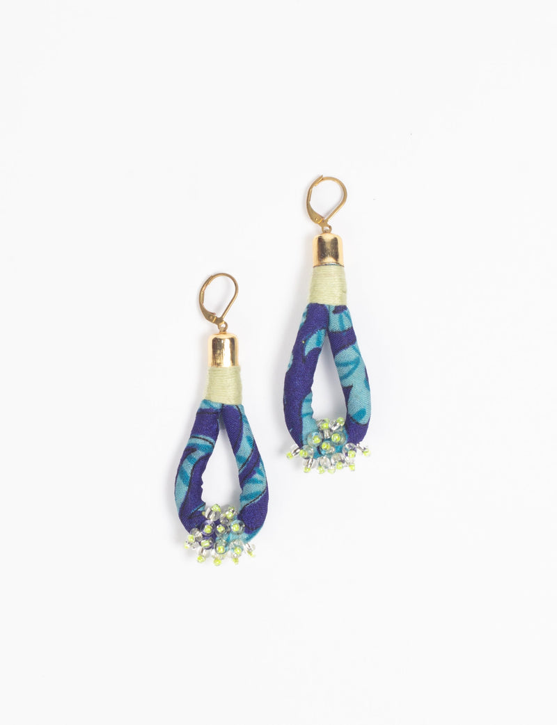 Blue fabric loop drop earrings with gold-tone tops and small green and clear bead clusters at the bottom
