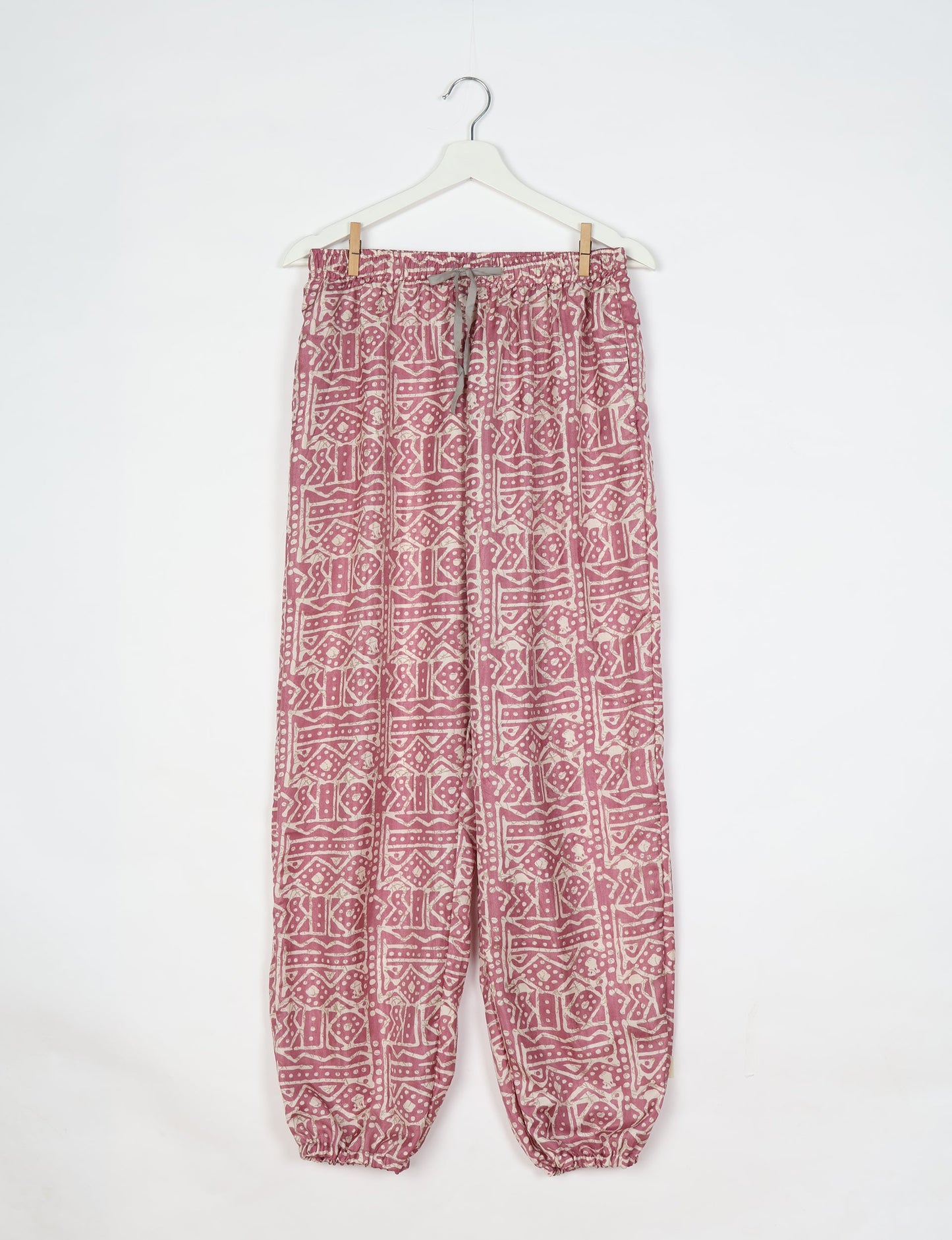 Comfortable and sustainable JOGGER PANTS, pull-on style crafted from eco-materials. Elastic drawstring waist, cotton twill tape, elasticated hems, and slant pockets for style and functionality. Make a positive impact on people and the planet with your fashion choices.