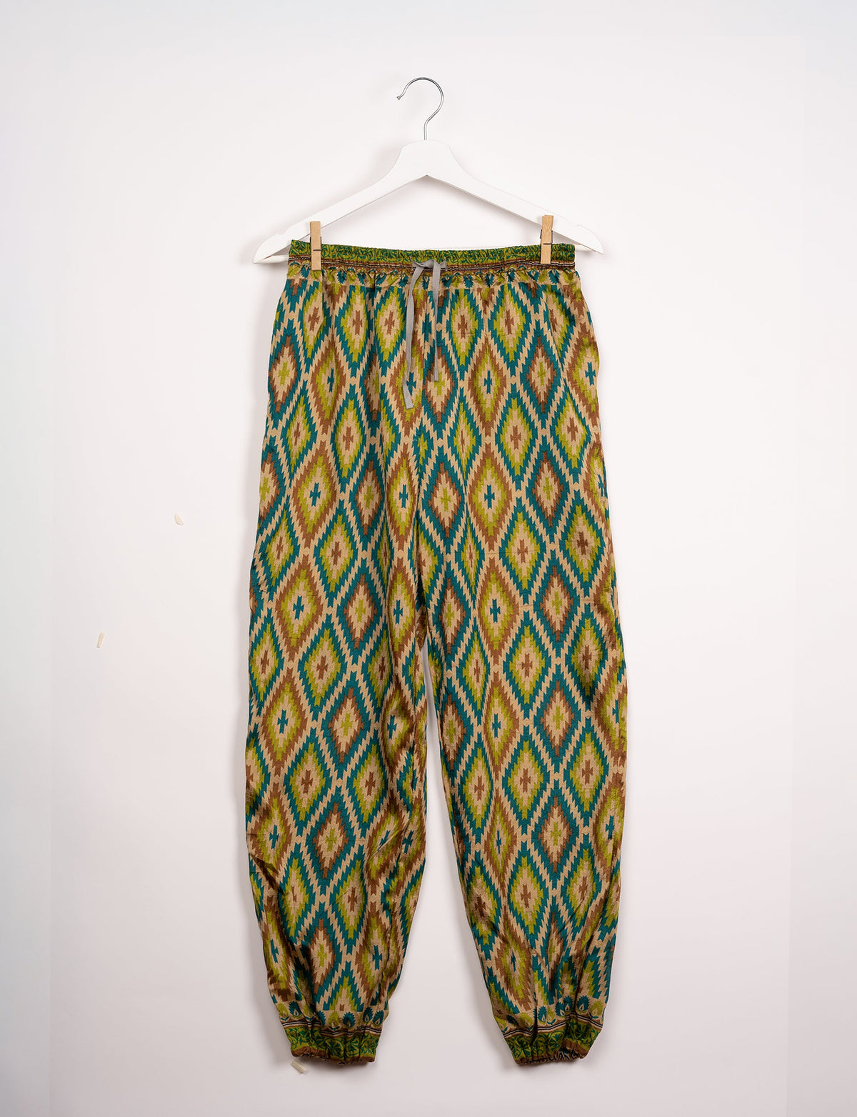 Comfortable and sustainable JOGGER PANTS, pull-on style crafted from eco-materials. Elastic drawstring waist, cotton twill tape, elasticated hems, and slant pockets for style and functionality. Make a positive impact on people and the planet with your fashion choices.