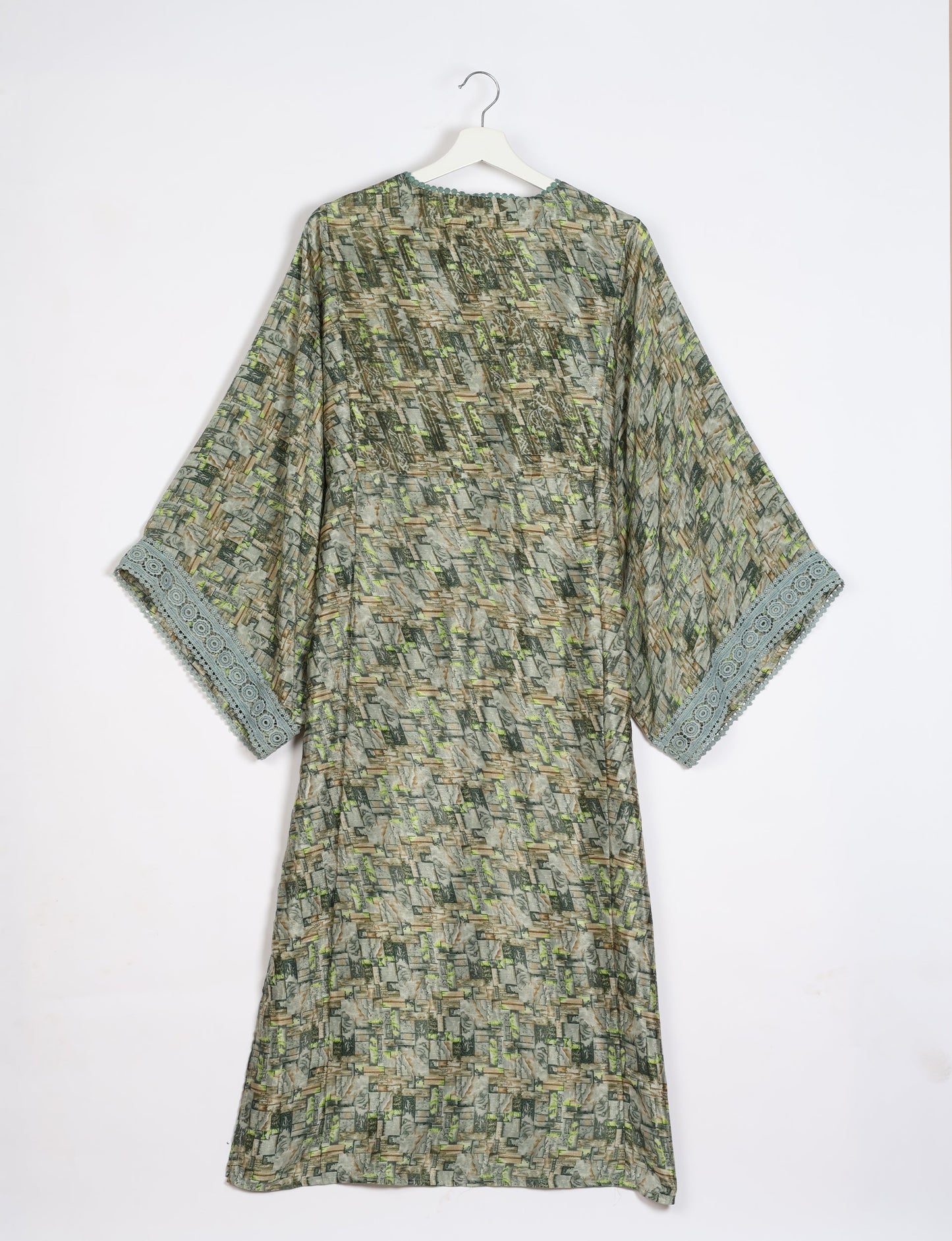 Maxi Kaftan with cotton lace on sleeves and midriff, featuring a tie-up neckline with tassels. Ankle-length, eco-friendly fashion made from recycled materials, offering sustainable women’s clothing for a chic, earth-friendly wardrobe.