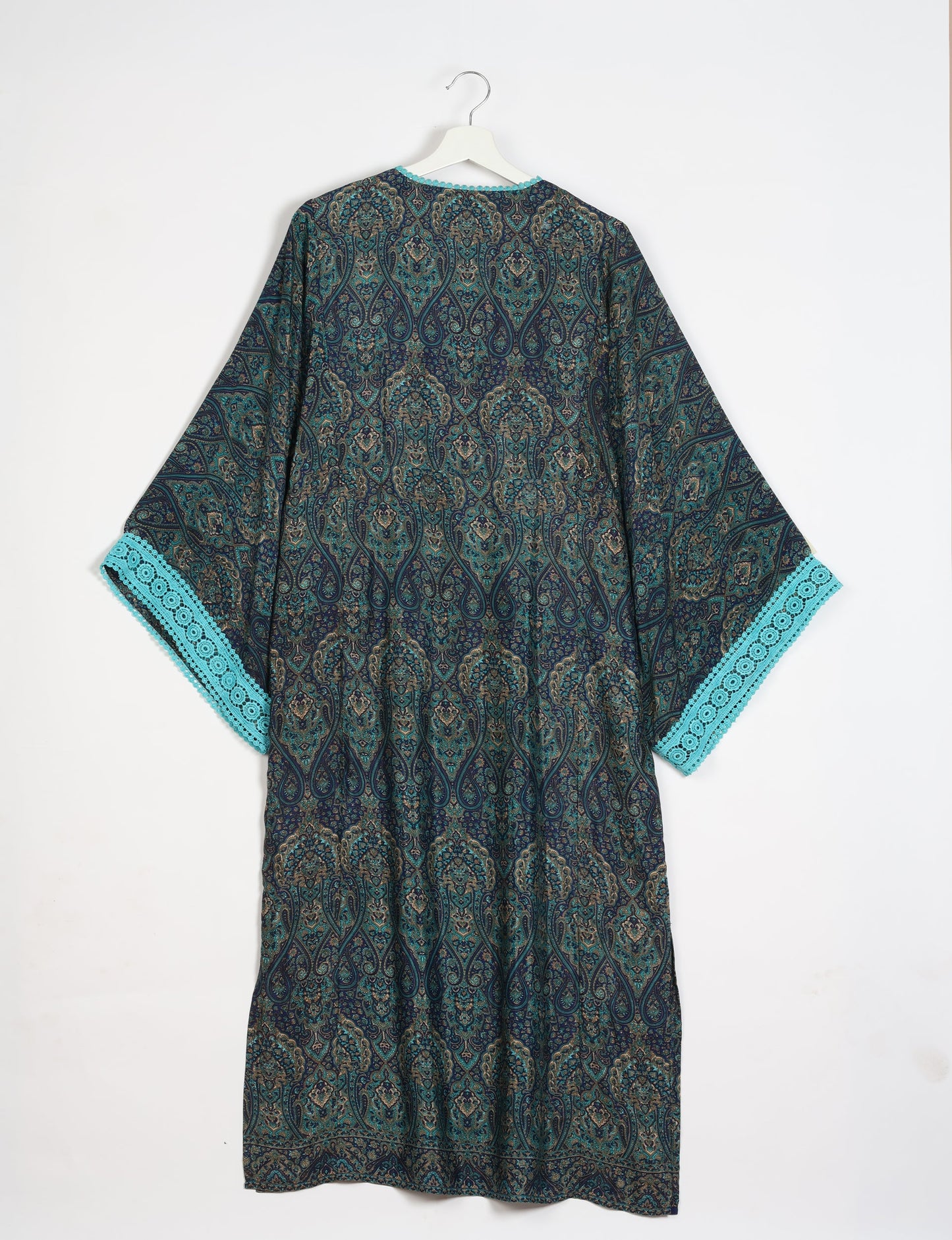 Maxi Kaftan with cotton lace on sleeves and midriff, featuring a tie-up neckline with tassels. Ankle-length, eco-friendly fashion made from recycled materials, offering sustainable women’s clothing for a chic, earth-friendly wardrobe.