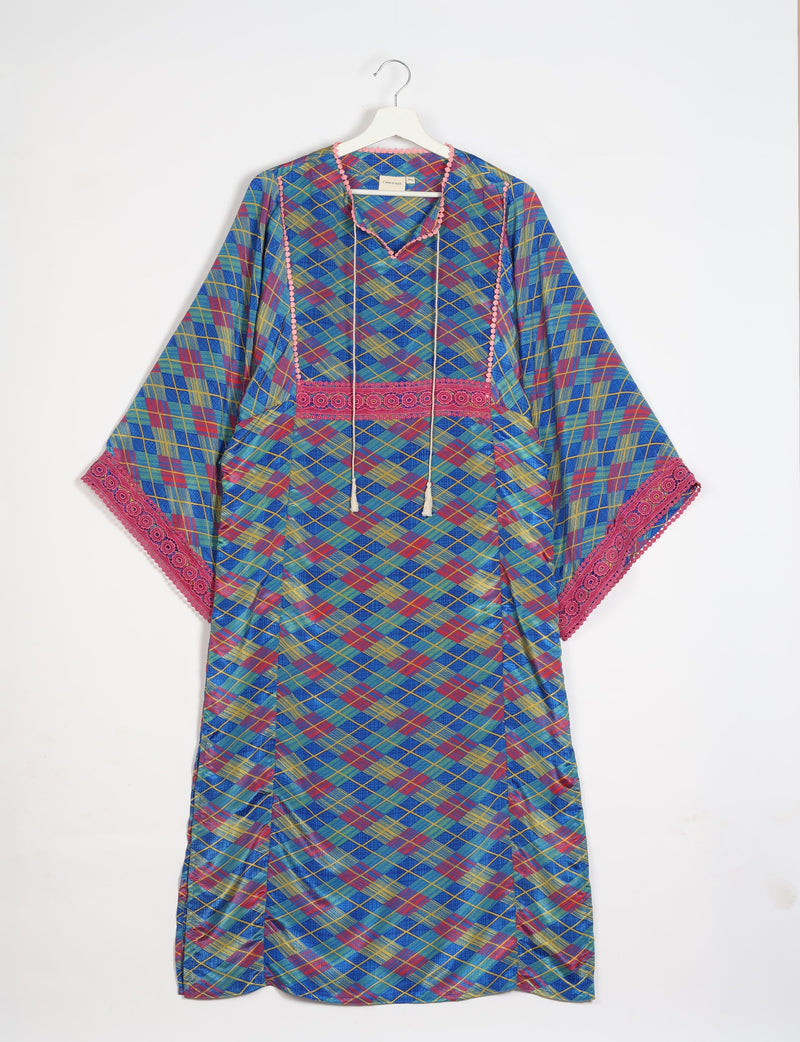 Blue geometric patterned maxi kaftan with pink lace trim on sleeves and neckline, hanging on white hanger front view