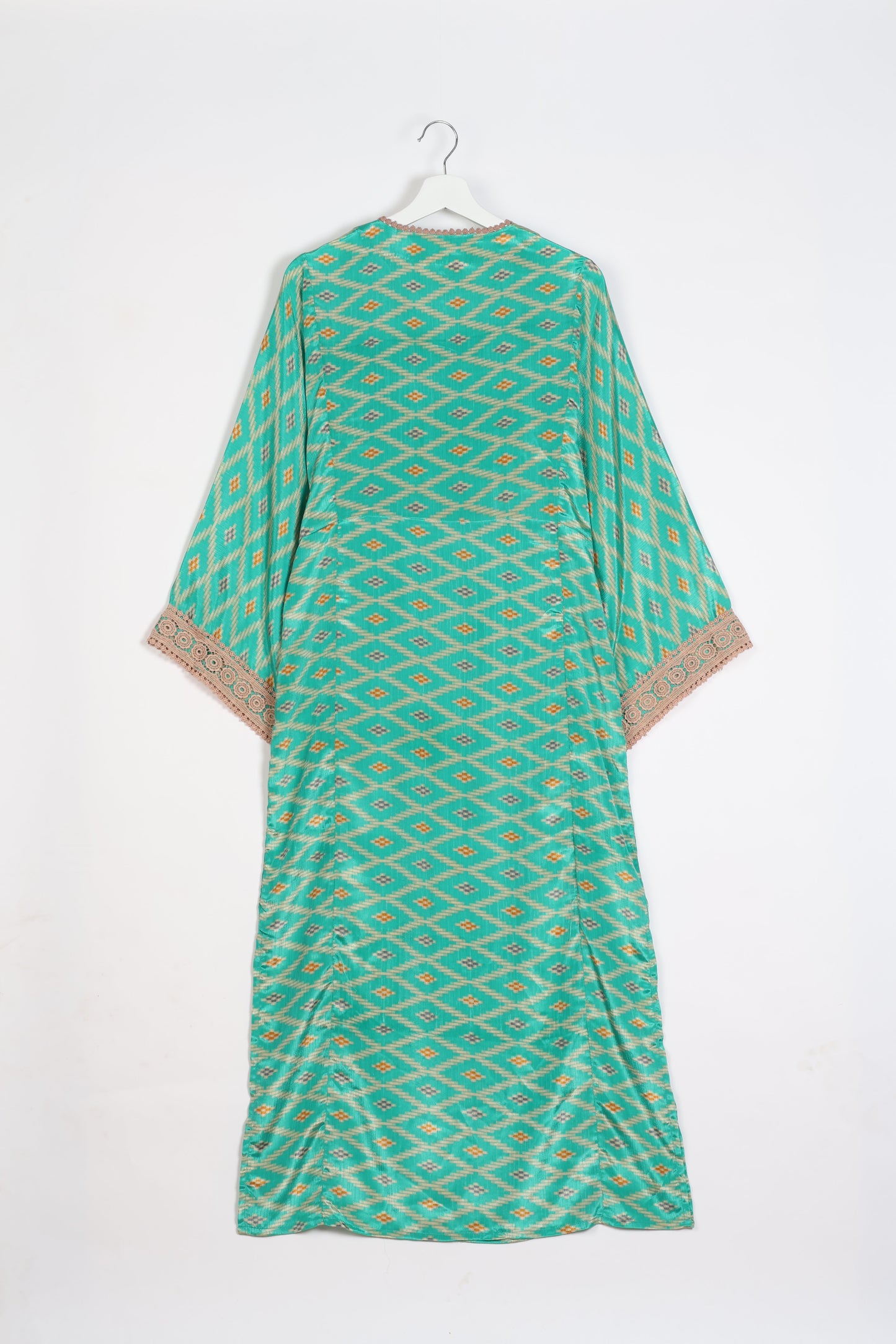 Maxi Kaftan with cotton lace on sleeves and midriff, featuring a tie-up neckline with tassels. Ankle-length, eco-friendly fashion made from recycled materials, offering sustainable women’s clothing for a chic, earth-friendly wardrobe.