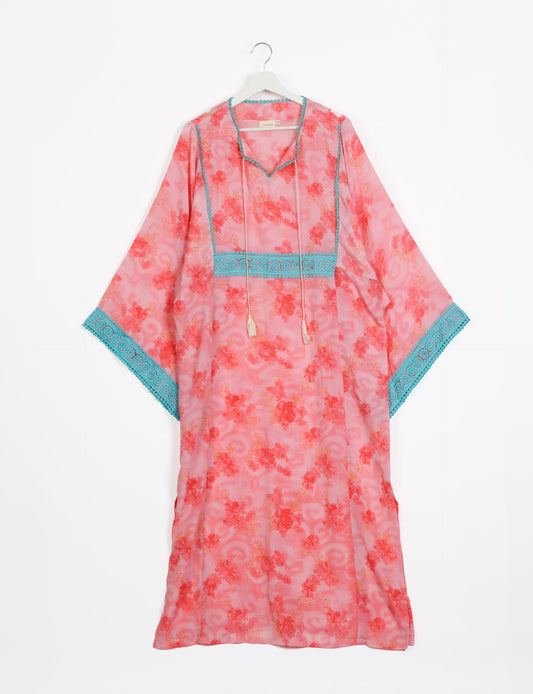 Maxi Kaftan with cotton lace on sleeves and midriff, featuring a tie-up neckline with tassels. Ankle-length, eco-friendly fashion made from recycled materials, offering sustainable women’s clothing for a chic, earth-friendly wardrobe.