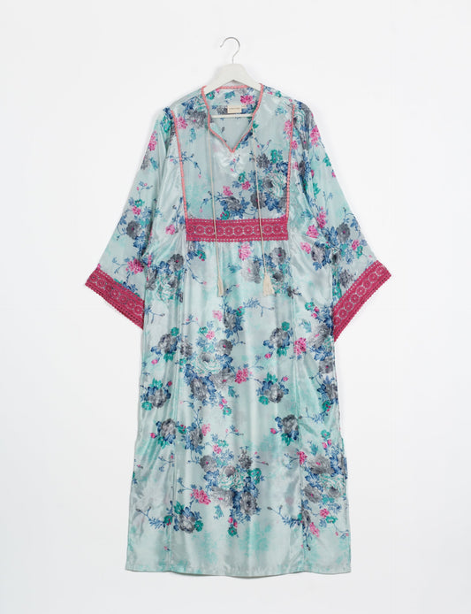 Maxi Kaftan with cotton lace on sleeves and midriff, featuring a tie-up neckline with tassels. Ankle-length, eco-friendly fashion made from recycled materials, offering sustainable women’s clothing for a chic, earth-friendly wardrobe.