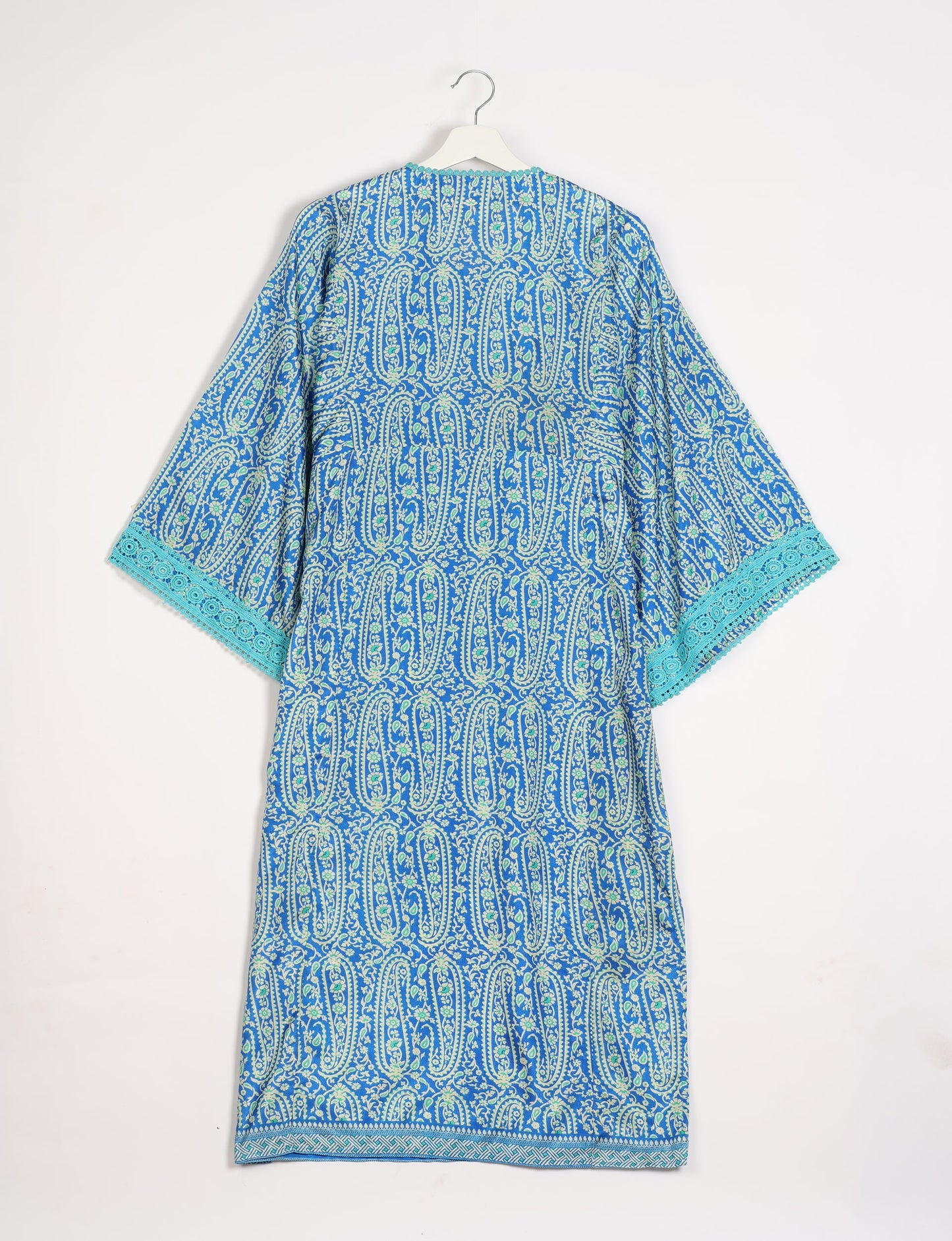 Maxi Kaftan with cotton lace on sleeves and midriff, featuring a tie-up neckline with tassels. Ankle-length, eco-friendly fashion made from recycled materials, offering sustainable women’s clothing for a chic, earth-friendly wardrobe.