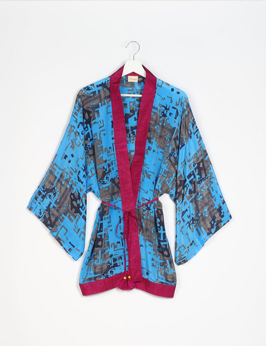 Chic and versatile KIMONO ROBE PRINT with a belt and loose straight-line sleeves. Throw it over swimwear, a t-shirt and shorts, leggings, or jeans for an instant style upgrade. Embrace fashionable versatility with this statement piece.