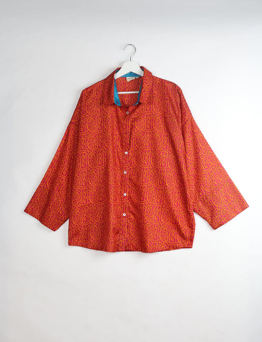 Experience chic comfort with our OVERSIZED SHIRT – a one-of-a-kind piece crafted from sari waste by talented Indian female artisans. With 3/4 length sleeves, a regular shirt collar, and a contrasting inner collar band, this shirt is perfect for work or casual hangouts. Versatile and stylish, it pairs effortlessly over a shift dress, jumpsuit, or with pants.