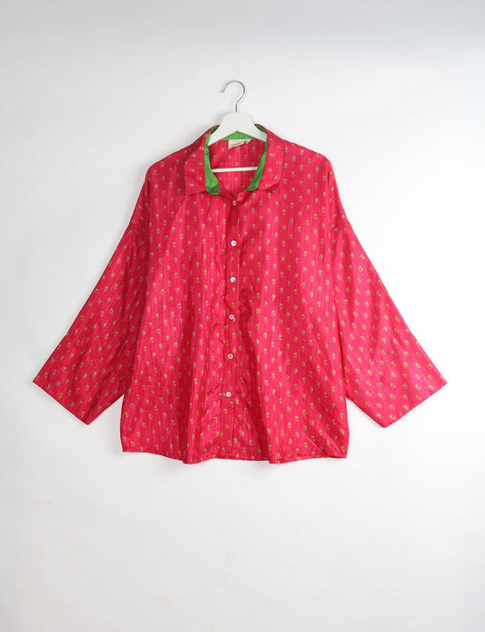 Experience chic comfort with our OVERSIZED SHIRT – a one-of-a-kind piece crafted from sari waste by talented Indian female artisans. With 3/4 length sleeves, a regular shirt collar, and a contrasting inner collar band, this shirt is perfect for work or casual hangouts. Versatile and stylish, it pairs effortlessly over a shift dress, jumpsuit, or with pants.