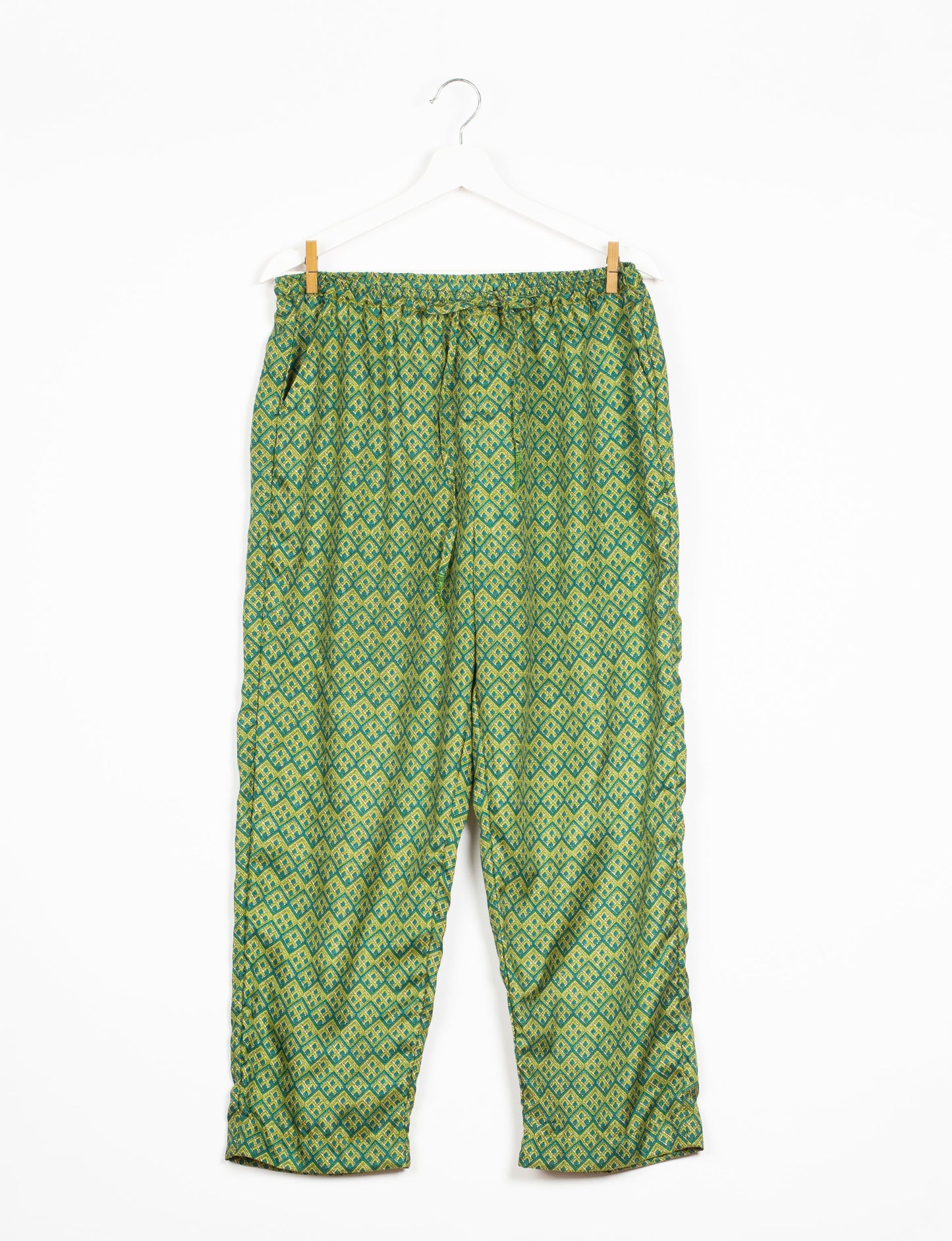 Elevate your wardrobe with our planet-friendly PULL-ON PANTS. Made from upcycled sari fabric, these eco-conscious pants offer a drawstring waist for a perfect fit. Tapered leg design ensures both style and comfort. Choose ethical, green fashion that supports artisans and sustainable living.