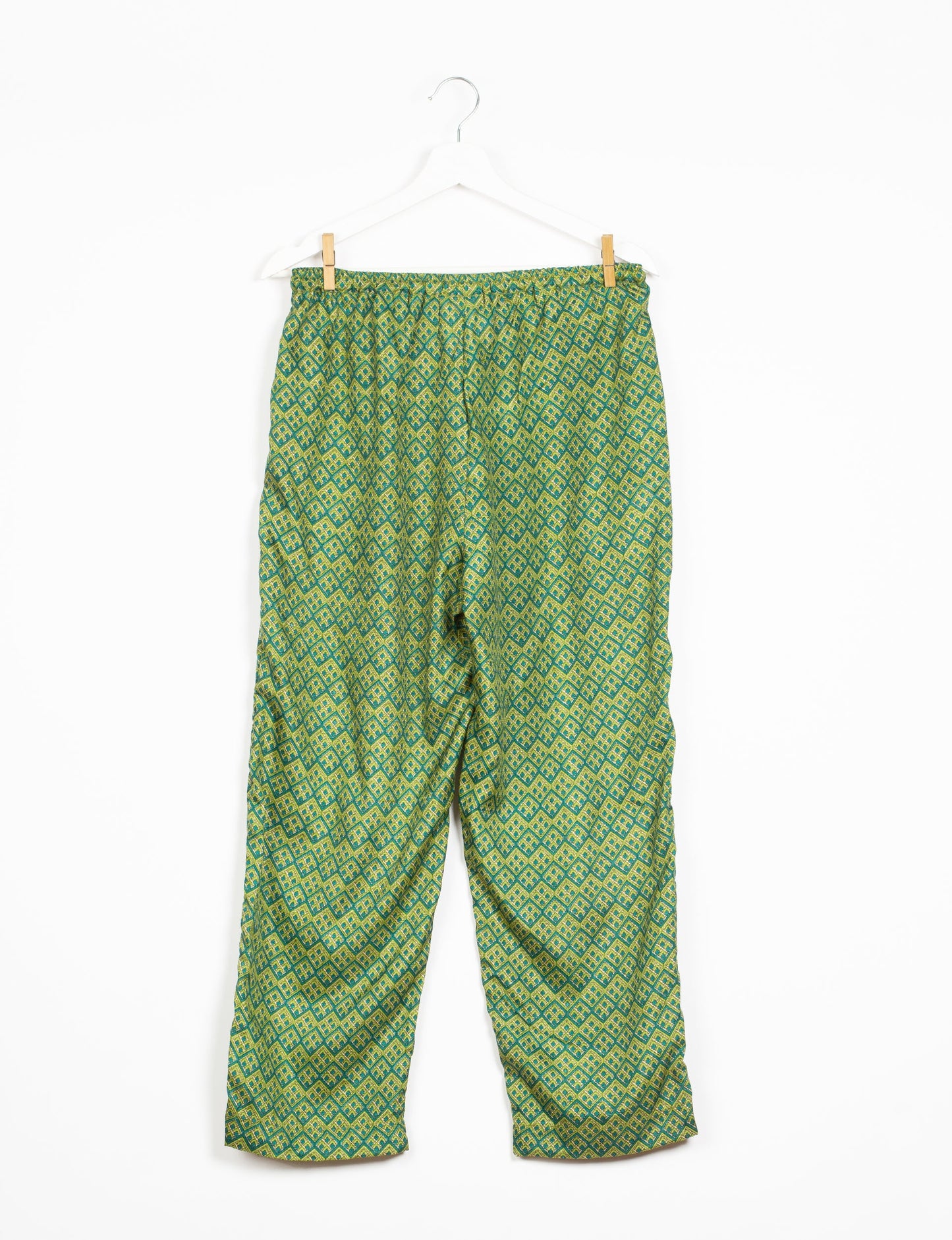 Elevate your wardrobe with our planet-friendly PULL-ON PANTS. Made from upcycled sari fabric, these eco-conscious pants offer a drawstring waist for a perfect fit. Tapered leg design ensures both style and comfort. Choose ethical, green fashion that supports artisans and sustainable living.