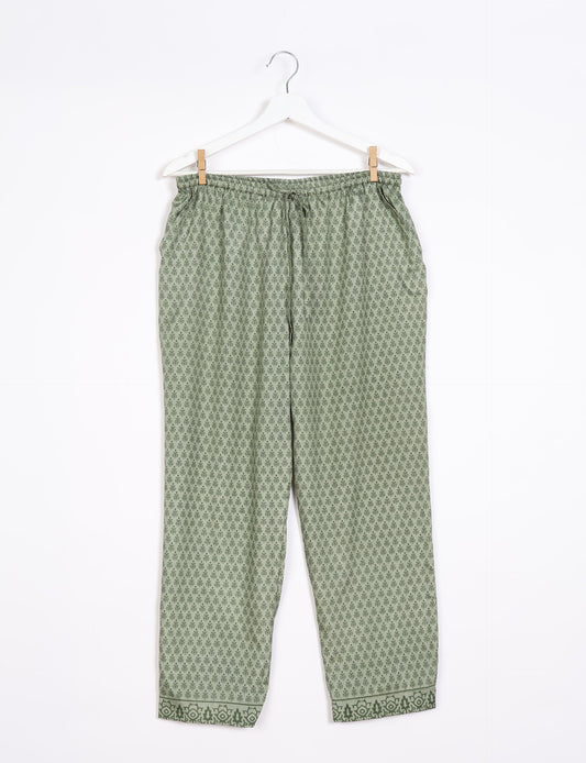 Elevate your wardrobe with our planet-friendly PULL-ON PANTS. Made from upcycled sari fabric, these eco-conscious pants offer a drawstring waist for a perfect fit. Tapered leg design ensures both style and comfort. Choose ethical, green fashion that supports artisans and sustainable living.