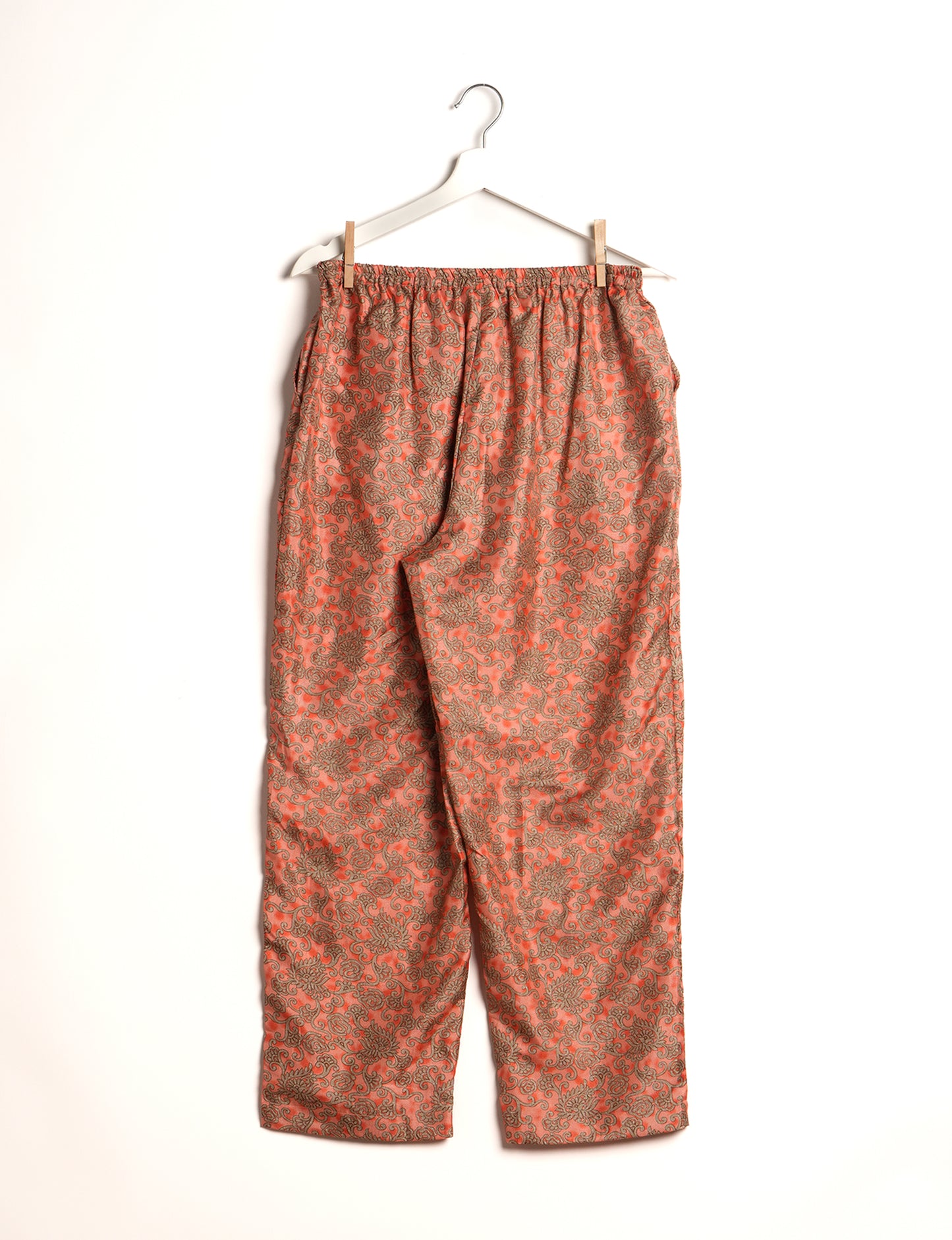 Elevate your wardrobe with our planet-friendly PULL-ON PANTS. Made from upcycled sari fabric, these eco-conscious pants offer a drawstring waist for a perfect fit. Tapered leg design ensures both style and comfort. Choose ethical, green fashion that supports artisans and sustainable living.