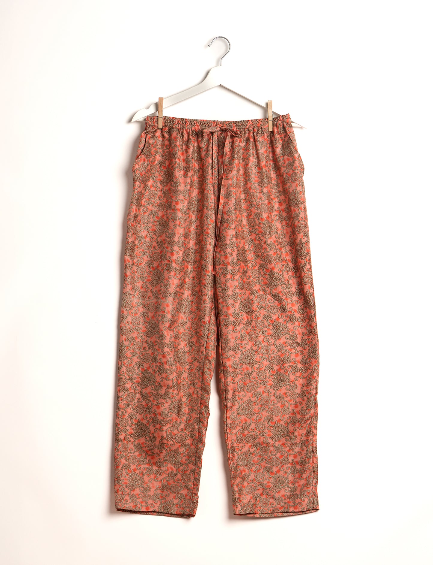 Elevate your wardrobe with our planet-friendly PULL-ON PANTS. Made from upcycled sari fabric, these eco-conscious pants offer a drawstring waist for a perfect fit. Tapered leg design ensures both style and comfort. Choose ethical, green fashion that supports artisans and sustainable living.