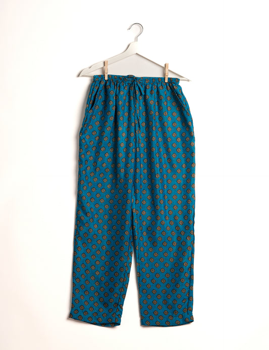 Elevate your wardrobe with our planet-friendly PULL-ON PANTS. Made from upcycled sari fabric, these eco-conscious pants offer a drawstring waist for a perfect fit. Tapered leg design ensures both style and comfort. Choose ethical, green fashion that supports artisans and sustainable living.