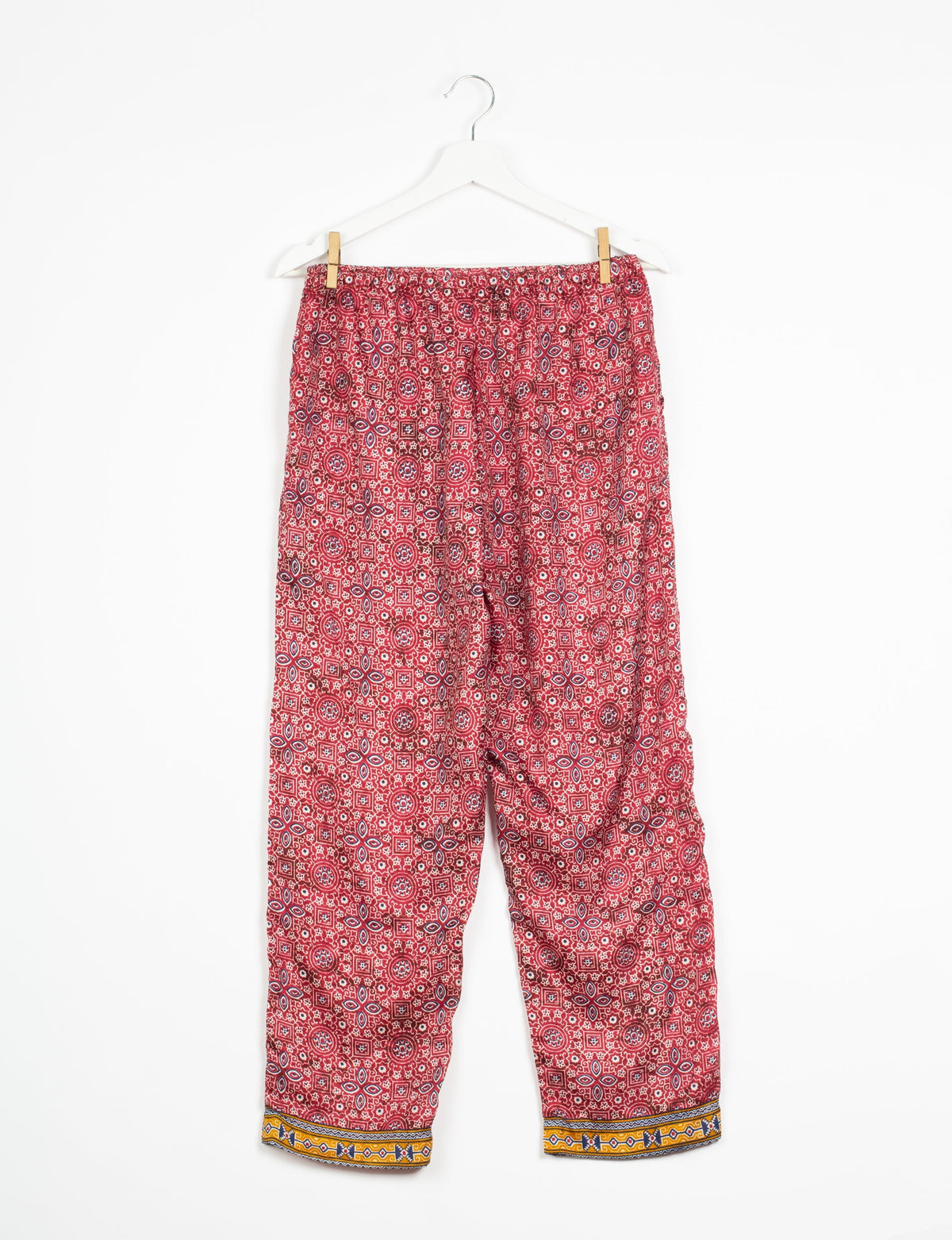 Elevate your wardrobe with our planet-friendly PULL-ON PANTS. Made from upcycled sari fabric, these eco-conscious pants offer a drawstring waist for a perfect fit. Tapered leg design ensures both style and comfort. Choose ethical, green fashion that supports artisans and sustainable living.