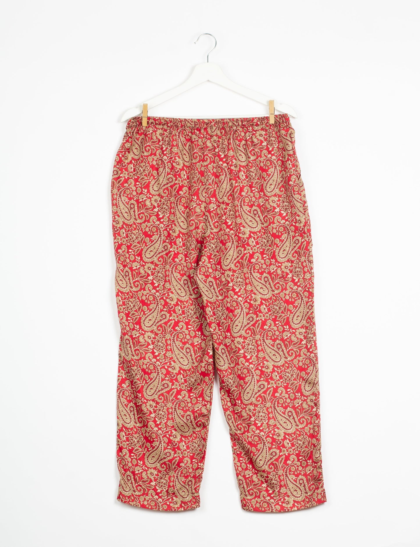 Elevate your wardrobe with our planet-friendly PULL-ON PANTS. Made from upcycled sari fabric, these eco-conscious pants offer a drawstring waist for a perfect fit. Tapered leg design ensures both style and comfort. Choose ethical, green fashion that supports artisans and sustainable living.