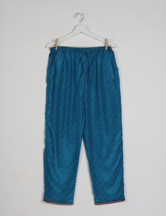 Elevate your wardrobe with our planet-friendly PULL-ON PANTS. Made from upcycled sari fabric, these eco-conscious pants offer a drawstring waist for a perfect fit. Tapered leg design ensures both style and comfort. Choose ethical, green fashion that supports artisans and sustainable living.