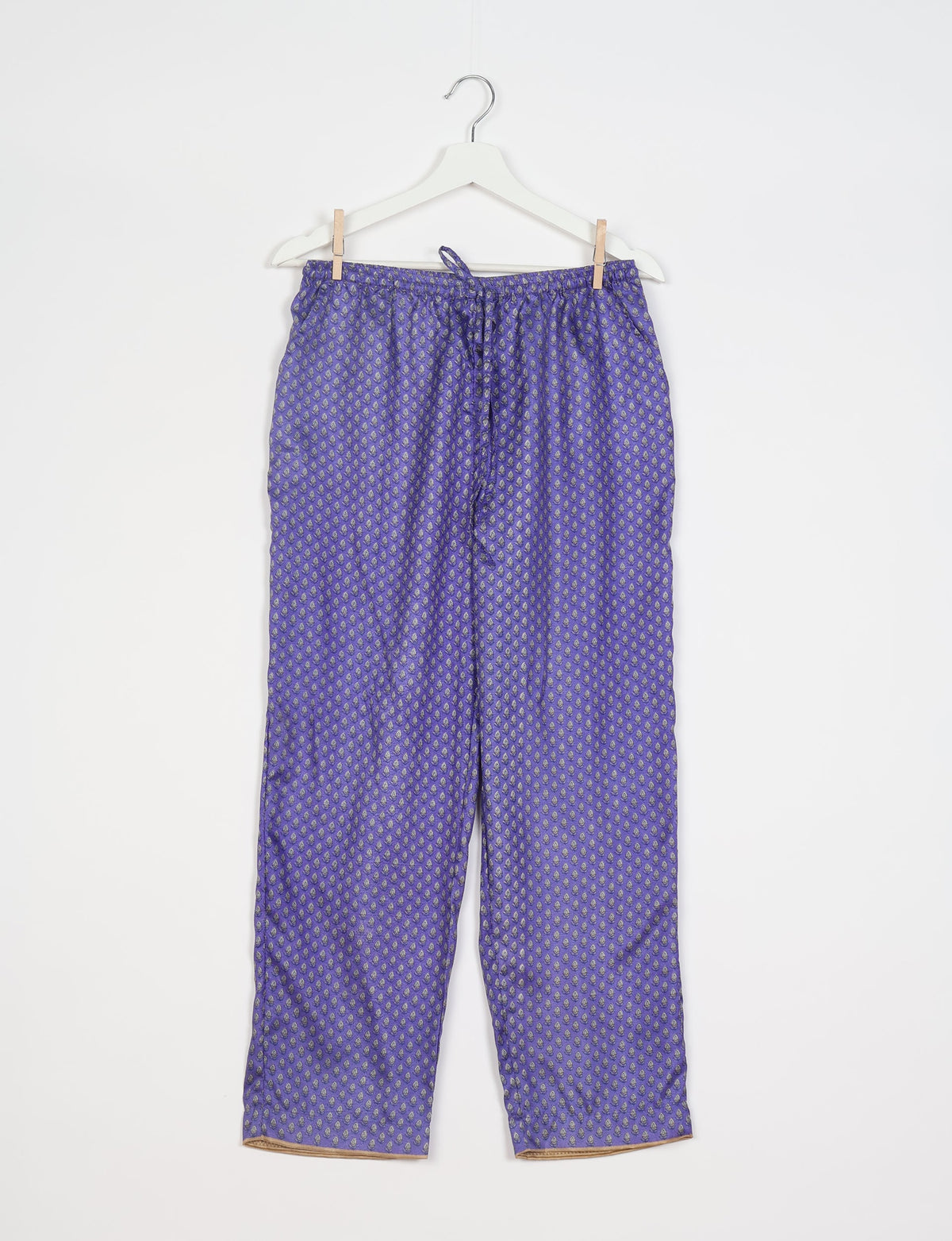 Elevate your wardrobe with our planet-friendly PULL-ON PANTS. Made from upcycled sari fabric, these eco-conscious pants offer a drawstring waist for a perfect fit. Tapered leg design ensures both style and comfort. Choose ethical, green fashion that supports artisans and sustainable living.