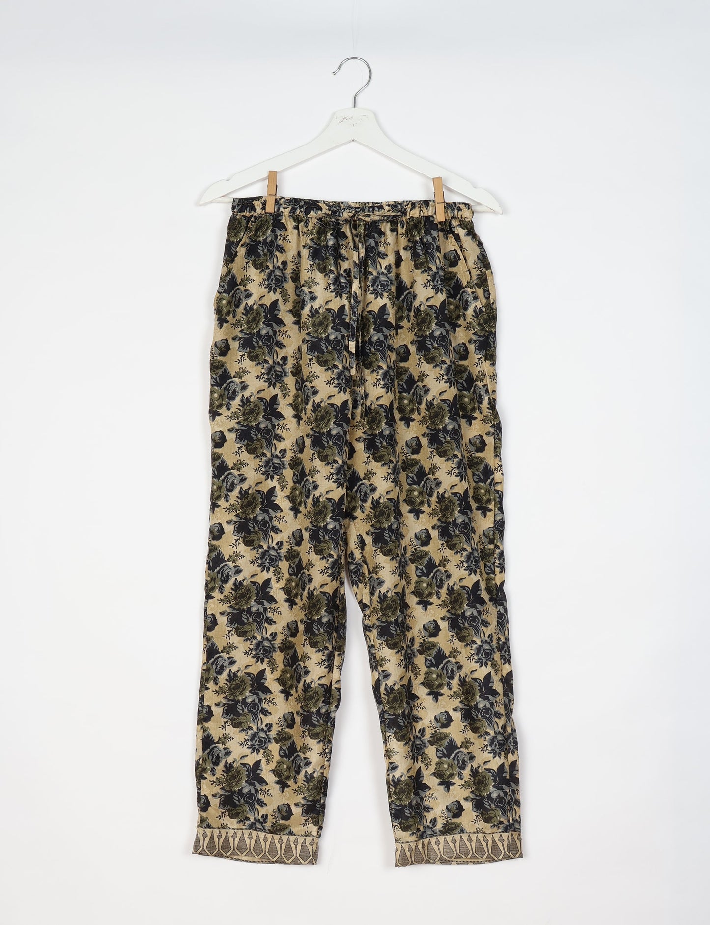 Elevate your wardrobe with our planet-friendly PULL-ON PANTS. Made from upcycled sari fabric, these eco-conscious pants offer a drawstring waist for a perfect fit. Tapered leg design ensures both style and comfort. Choose ethical, green fashion that supports artisans and sustainable living.