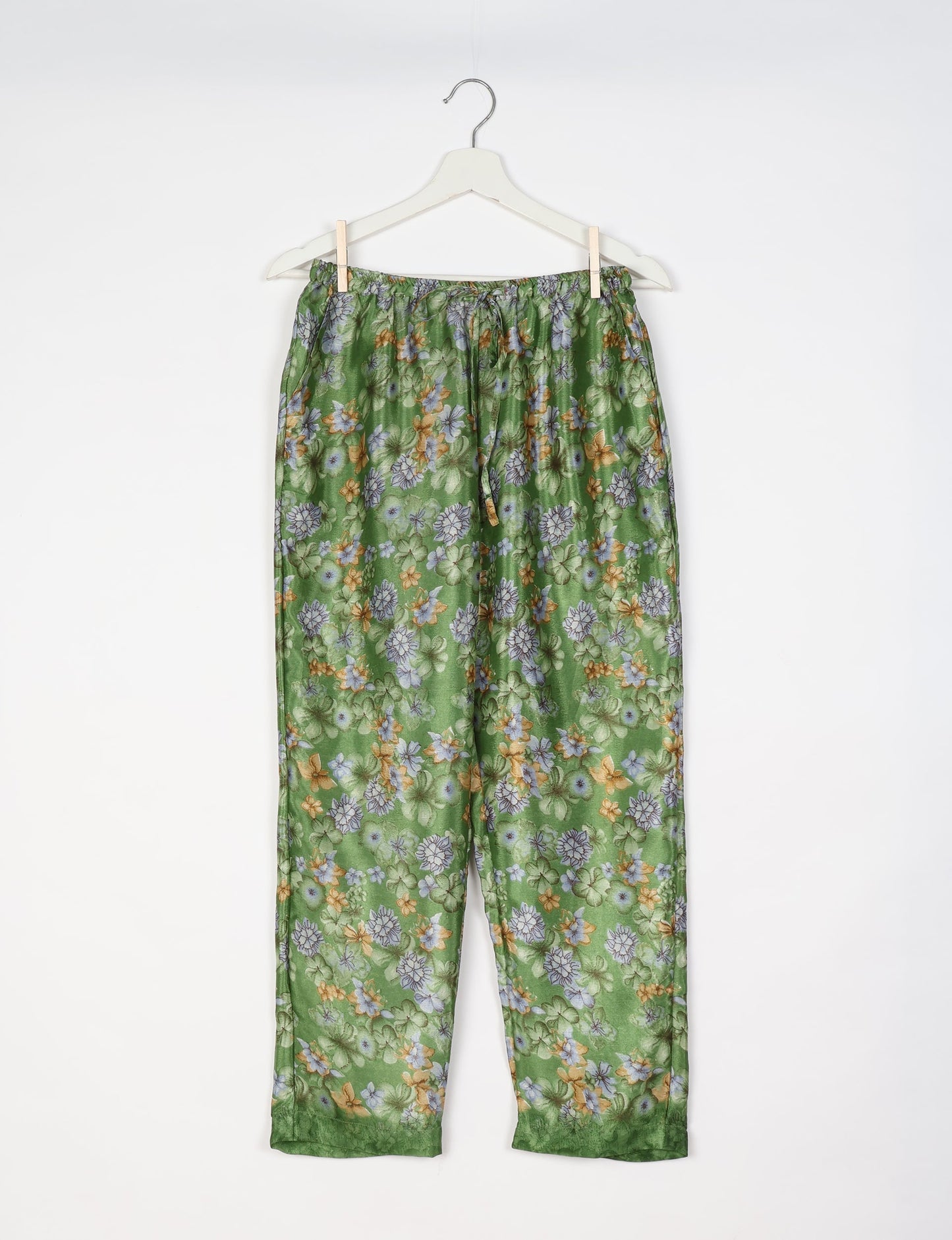 Elevate your wardrobe with our planet-friendly PULL-ON PANTS. Made from upcycled sari fabric, these eco-conscious pants offer a drawstring waist for a perfect fit. Tapered leg design ensures both style and comfort. Choose ethical, green fashion that supports artisans and sustainable living.