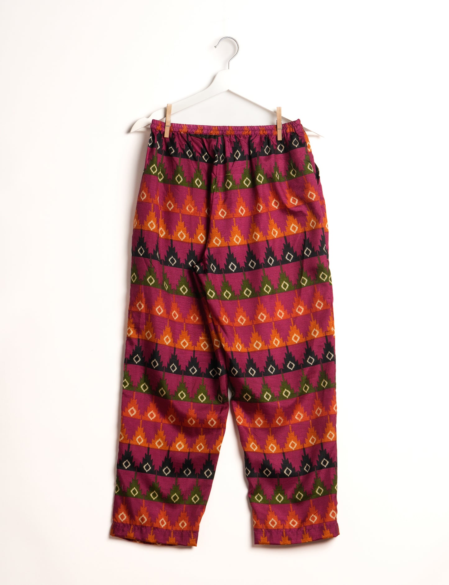 Elevate your wardrobe with our planet-friendly PULL-ON PANTS. Made from upcycled sari fabric, these eco-conscious pants offer a drawstring waist for a perfect fit. Tapered leg design ensures both style and comfort. Choose ethical, green fashion that supports artisans and sustainable living.