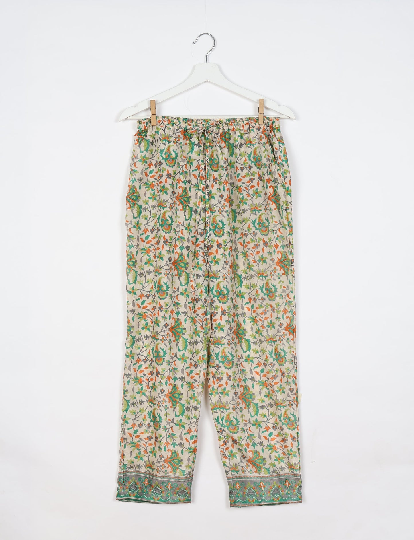 Elevate your wardrobe with our planet-friendly PULL-ON PANTS. Made from upcycled sari fabric, these eco-conscious pants offer a drawstring waist for a perfect fit. Tapered leg design ensures both style and comfort. Choose ethical, green fashion that supports artisans and sustainable living.