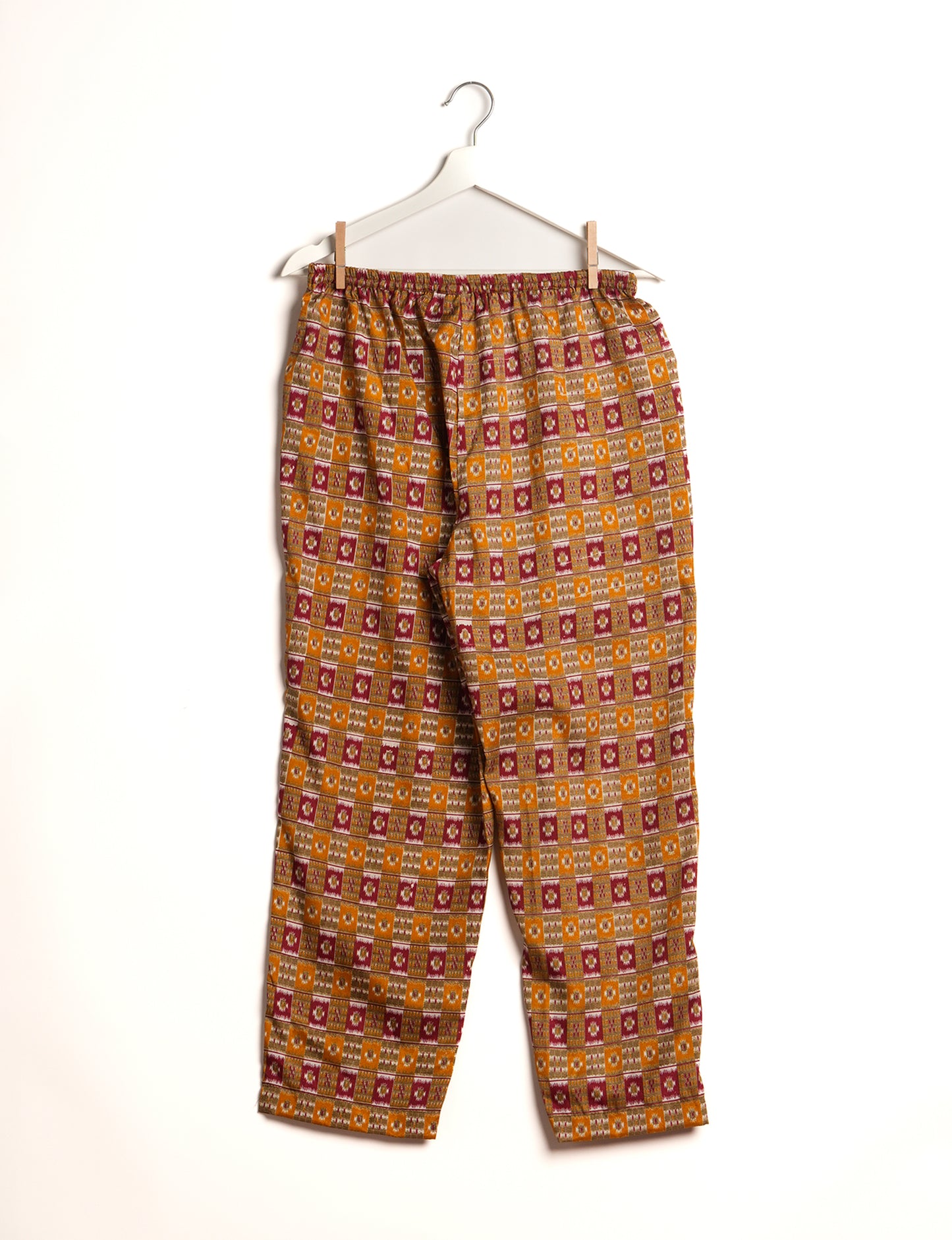 Elevate your wardrobe with our planet-friendly PULL-ON PANTS. Made from upcycled sari fabric, these eco-conscious pants offer a drawstring waist for a perfect fit. Tapered leg design ensures both style and comfort. Choose ethical, green fashion that supports artisans and sustainable living.