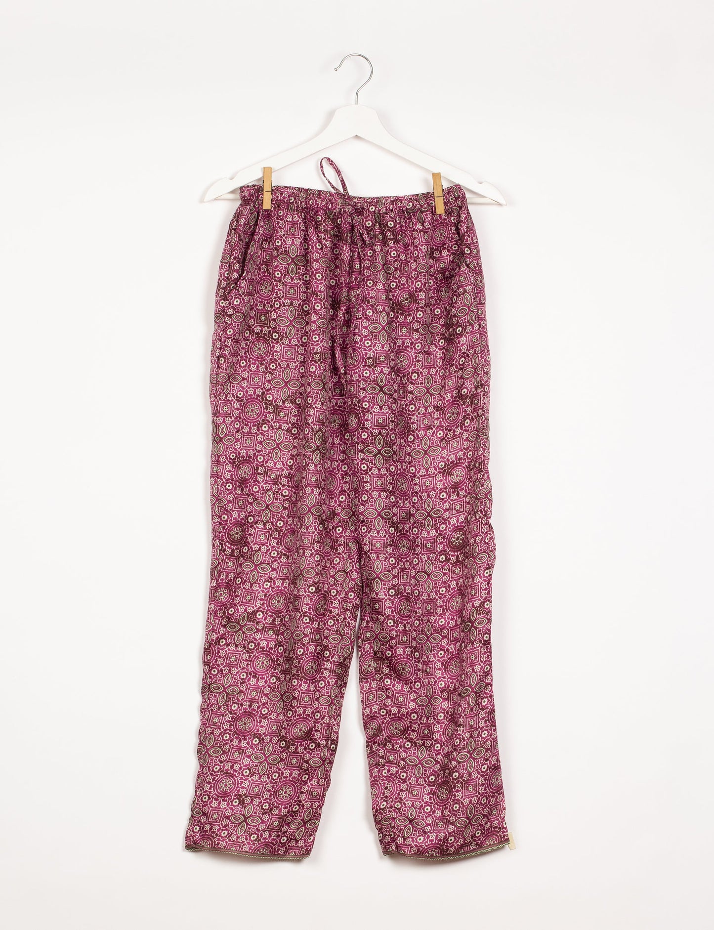 Elevate your wardrobe with our planet-friendly PULL-ON PANTS. Made from upcycled sari fabric, these eco-conscious pants offer a drawstring waist for a perfect fit. Tapered leg design ensures both style and comfort. Choose ethical, green fashion that supports artisans and sustainable living.