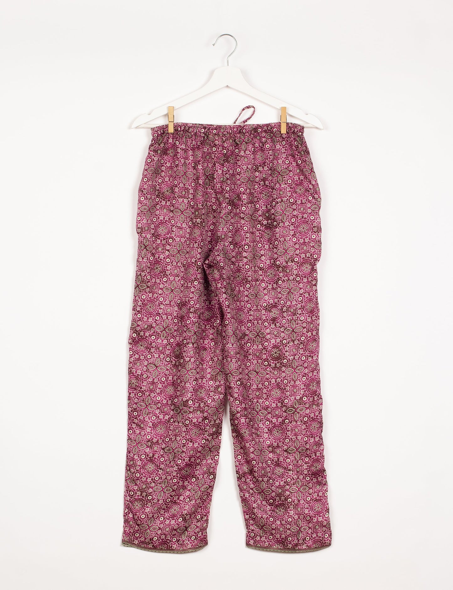 Elevate your wardrobe with our planet-friendly PULL-ON PANTS. Made from upcycled sari fabric, these eco-conscious pants offer a drawstring waist for a perfect fit. Tapered leg design ensures both style and comfort. Choose ethical, green fashion that supports artisans and sustainable living.