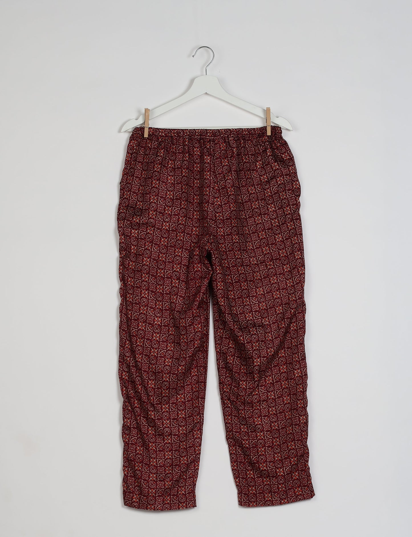 Elevate your wardrobe with our planet-friendly PULL-ON PANTS. Made from upcycled sari fabric, these eco-conscious pants offer a drawstring waist for a perfect fit. Tapered leg design ensures both style and comfort. Choose ethical, green fashion that supports artisans and sustainable living.