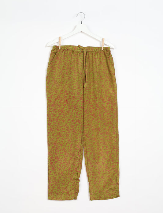 Elevate your wardrobe with our planet-friendly PULL-ON PANTS. Made from upcycled sari fabric, these eco-conscious pants offer a drawstring waist for a perfect fit. Tapered leg design ensures both style and comfort. Choose ethical, green fashion that supports artisans and sustainable living.