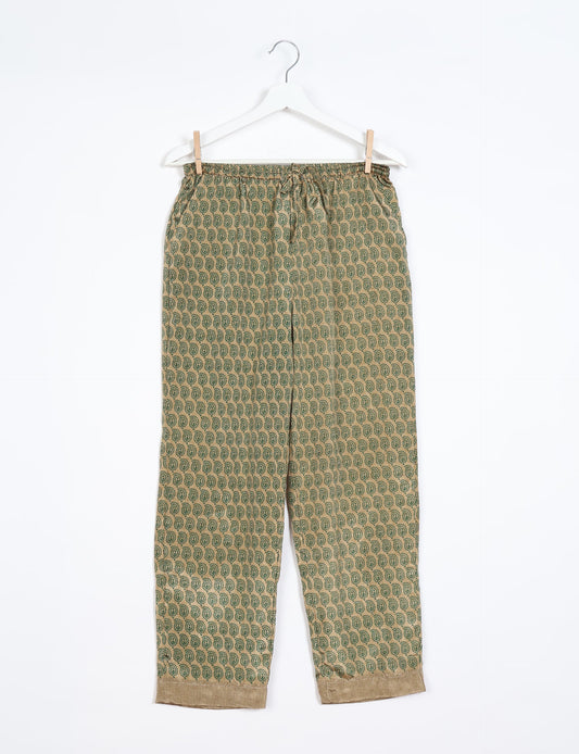 Elevate your wardrobe with our planet-friendly PULL-ON PANTS. Made from upcycled sari fabric, these eco-conscious pants offer a drawstring waist for a perfect fit. Tapered leg design ensures both style and comfort. Choose ethical, green fashion that supports artisans and sustainable living.