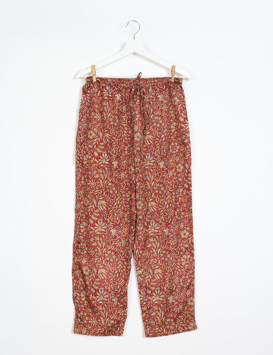 Elevate your wardrobe with our planet-friendly PULL-ON PANTS. Made from upcycled sari fabric, these eco-conscious pants offer a drawstring waist for a perfect fit. Tapered leg design ensures both style and comfort. Choose ethical, green fashion that supports artisans and sustainable living.