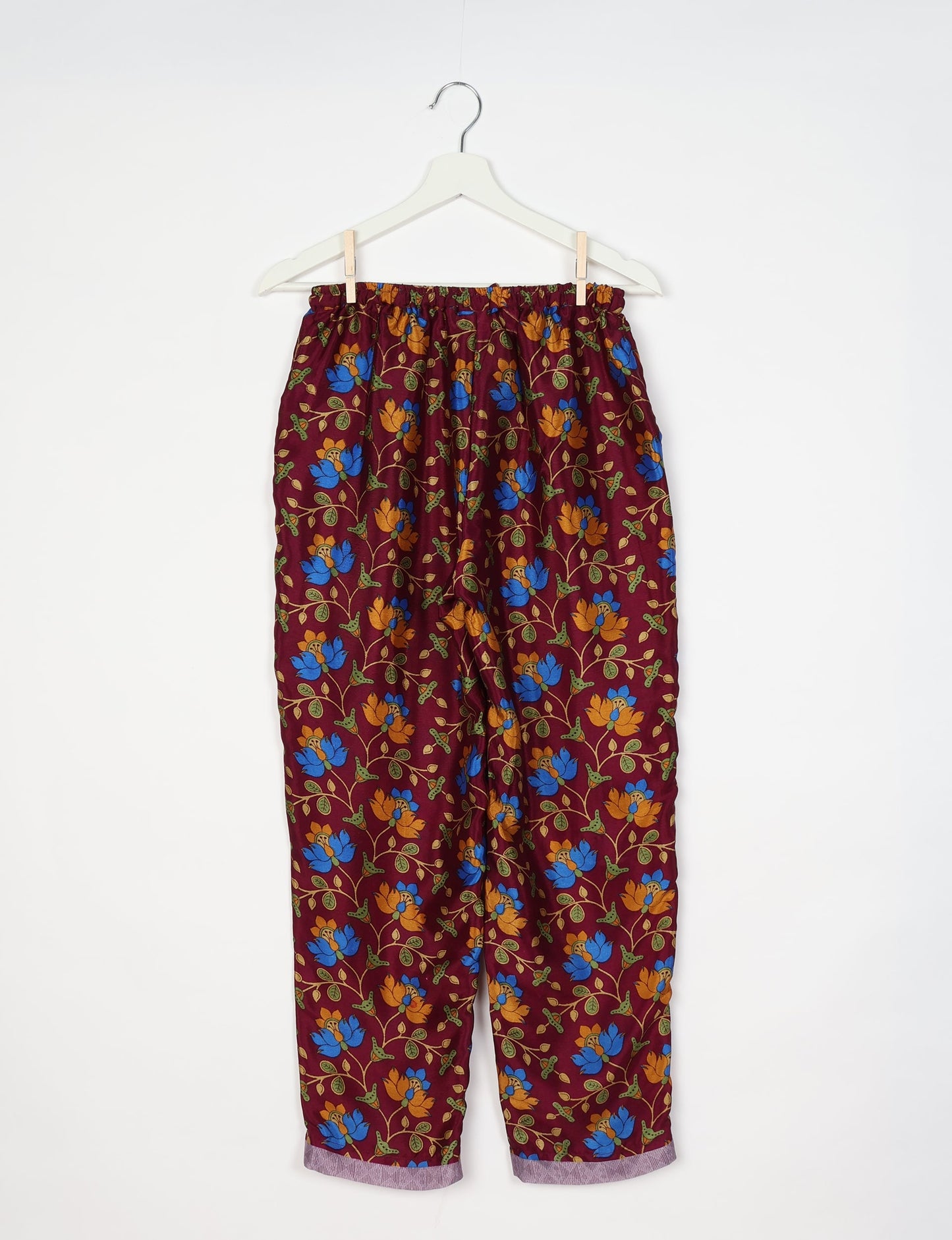 Elevate your wardrobe with our planet-friendly PULL-ON PANTS. Made from upcycled sari fabric, these eco-conscious pants offer a drawstring waist for a perfect fit. Tapered leg design ensures both style and comfort. Choose ethical, green fashion that supports artisans and sustainable living.