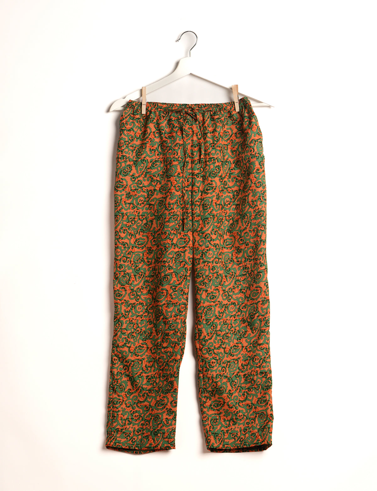 Elevate your wardrobe with our planet-friendly PULL-ON PANTS. Made from upcycled sari fabric, these eco-conscious pants offer a drawstring waist for a perfect fit. Tapered leg design ensures both style and comfort. Choose ethical, green fashion that supports artisans and sustainable living.